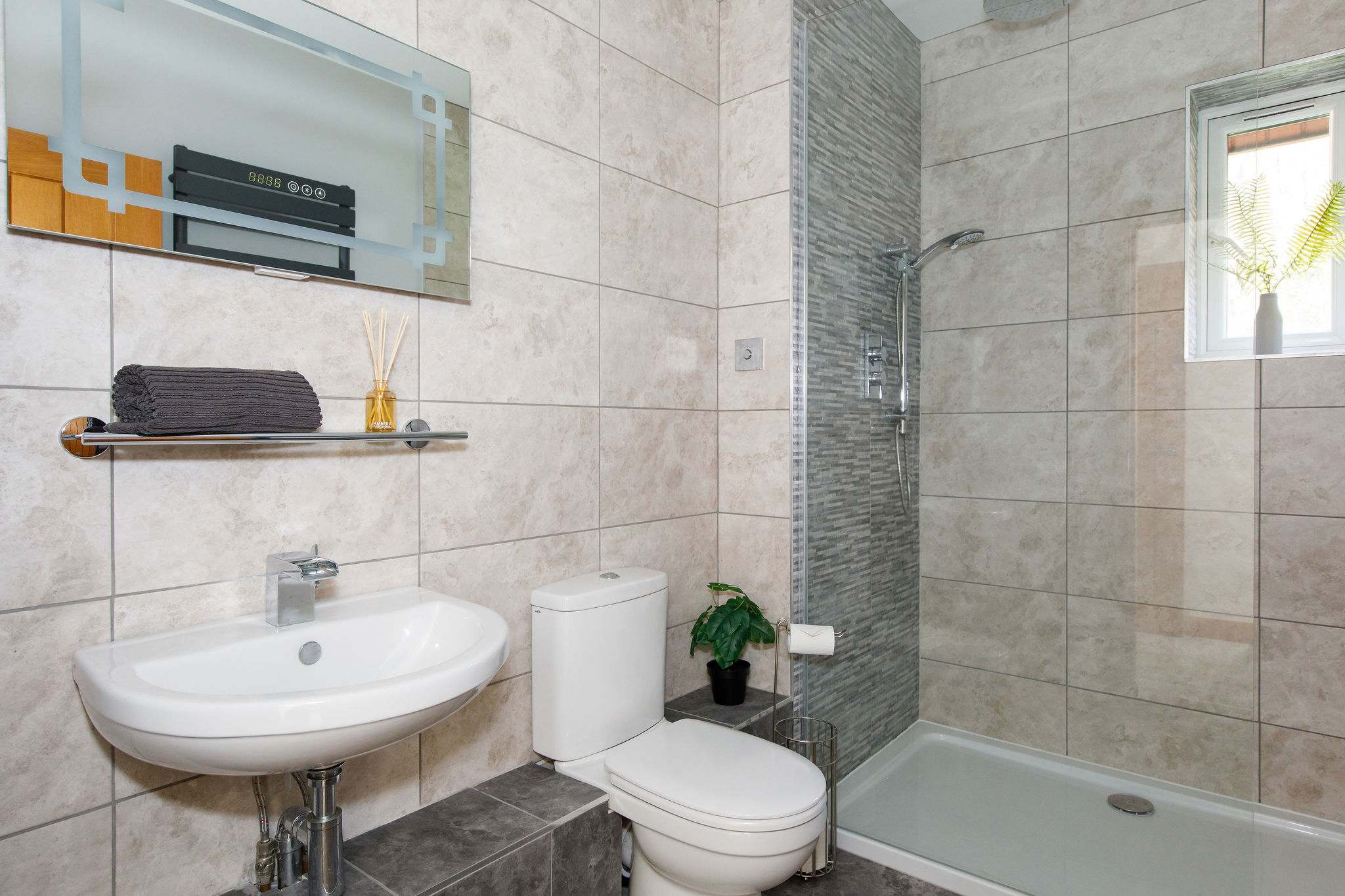 En-suite to king room with walk in shower, WC and sink.