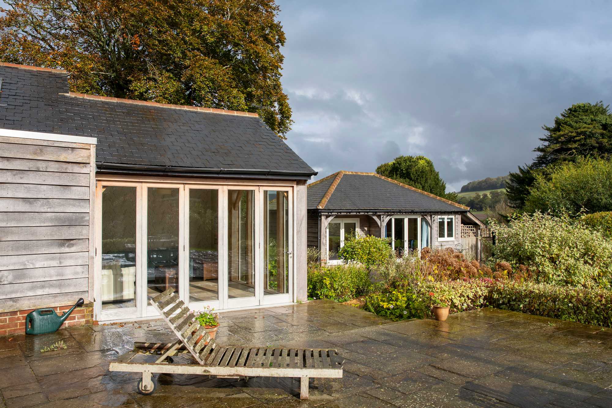 View showing the corner of the kitchen with patio doors then onto the annexe.