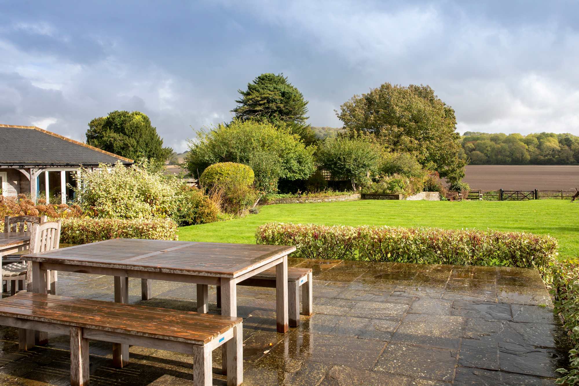 View from the patio out onto the garden onto the fields and downs, simply stunning!