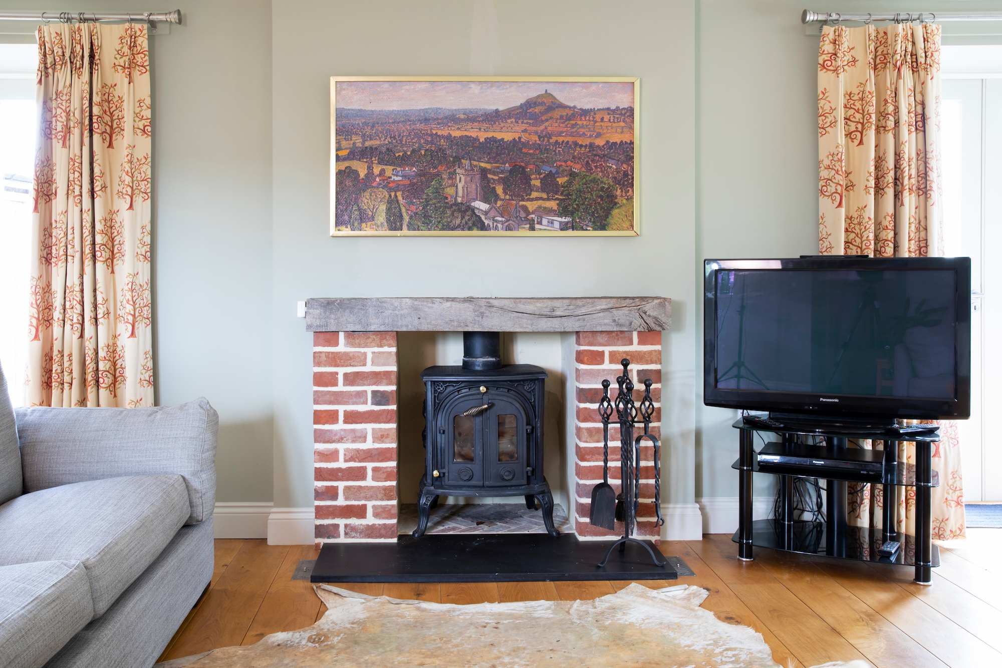 The main lounge is a superb space with wood burner and large lcd television