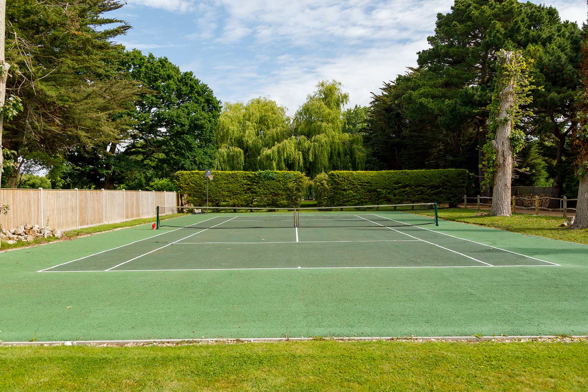 You'll find a number of amazing amenities at the home, including a tennis court.