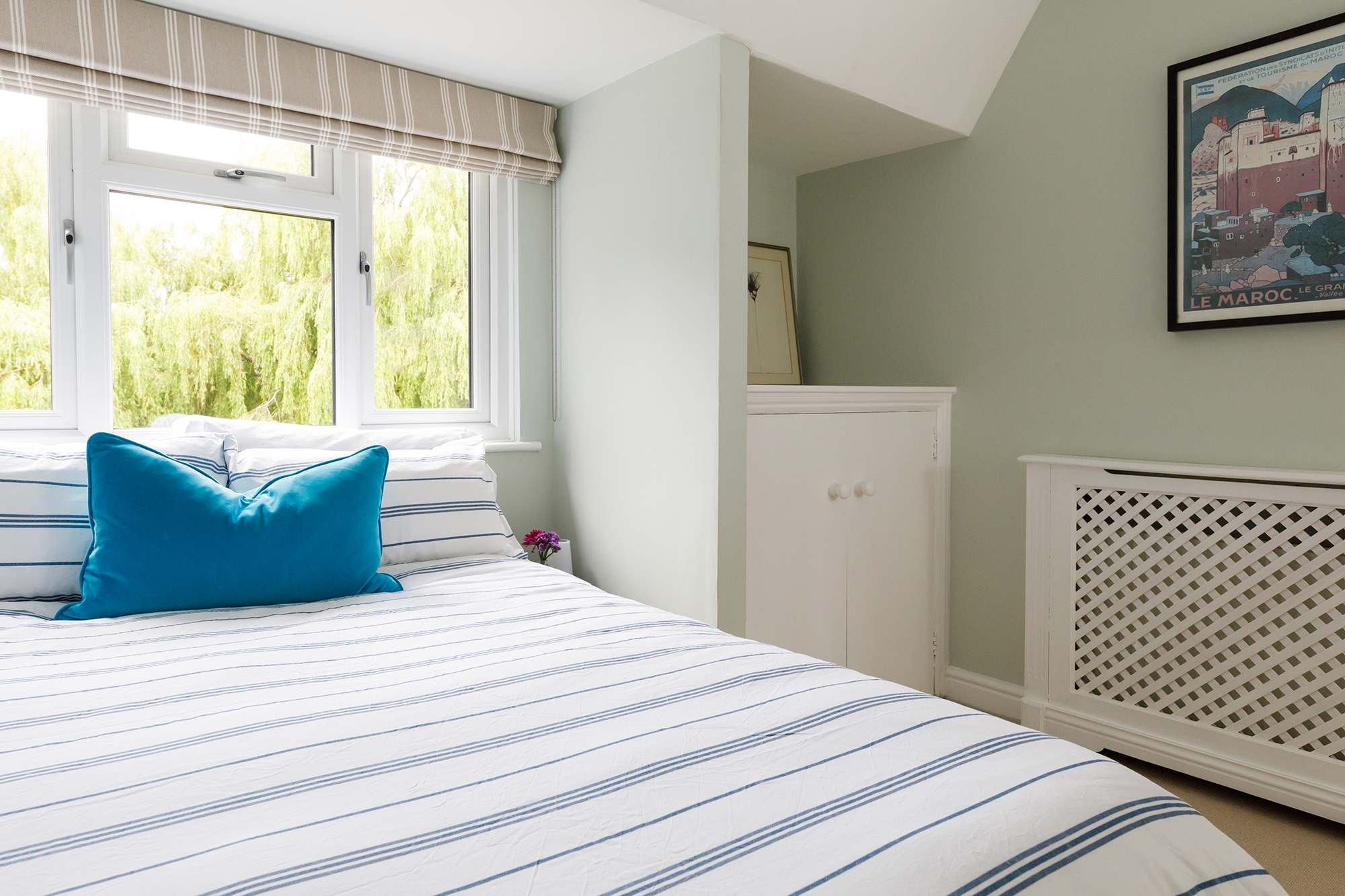 Soft greens and creams create a relaxing double..