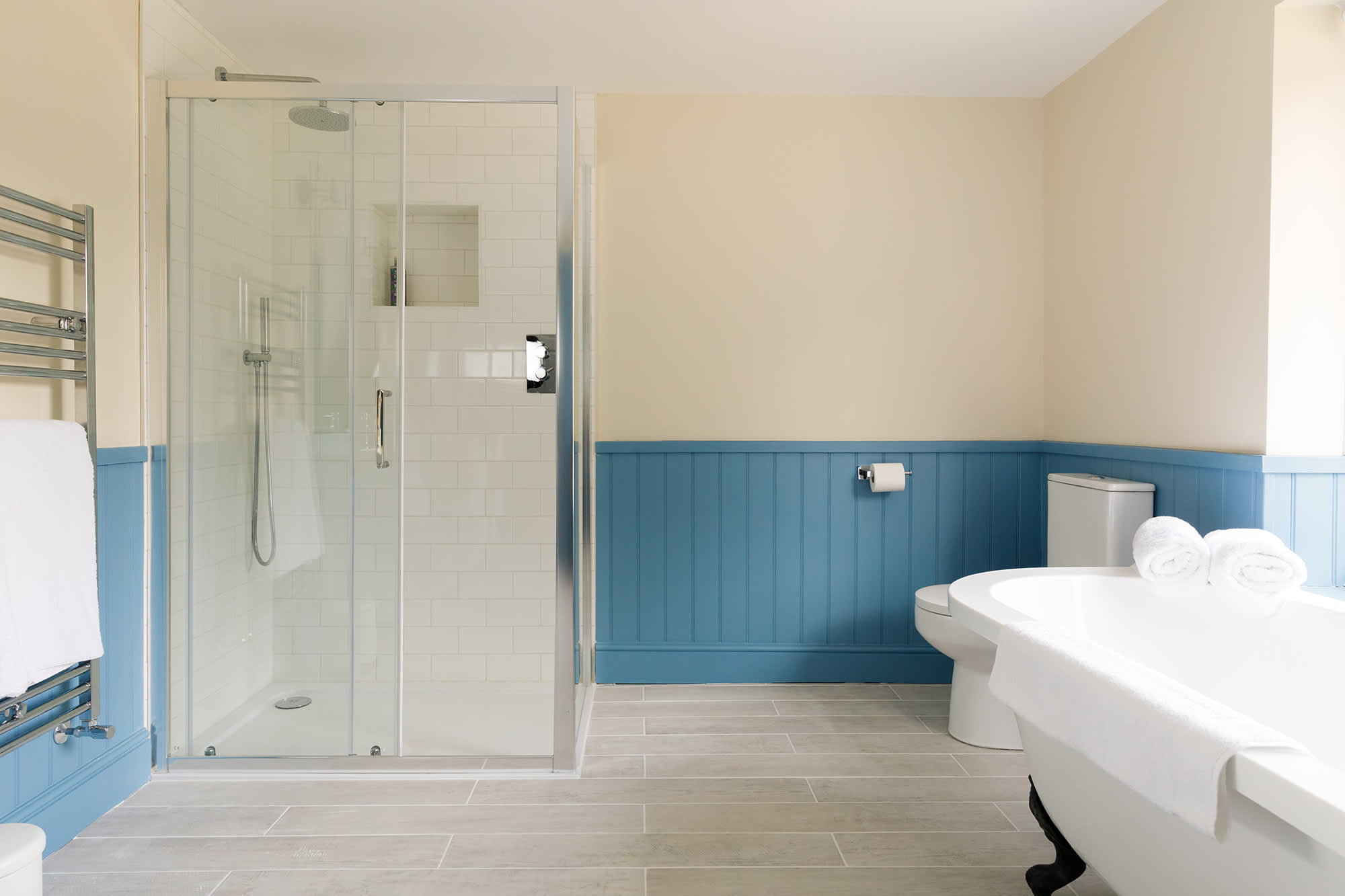 The large ensuite has a free standing bath and separate shower.