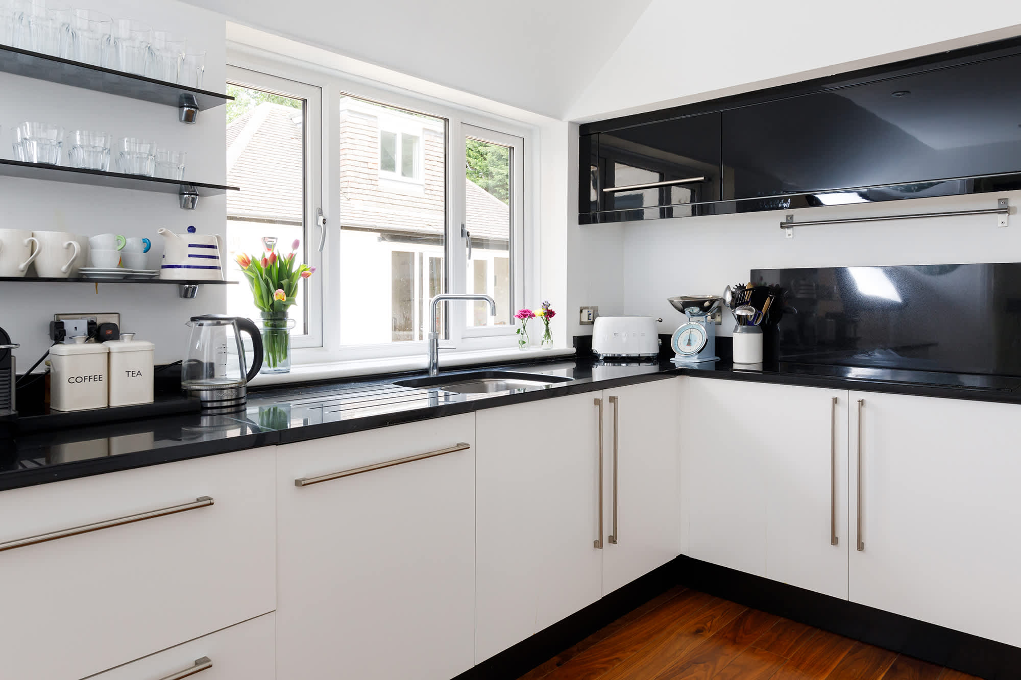 The kitchen has a electric hob, double oven, double fridge and dishwasher.