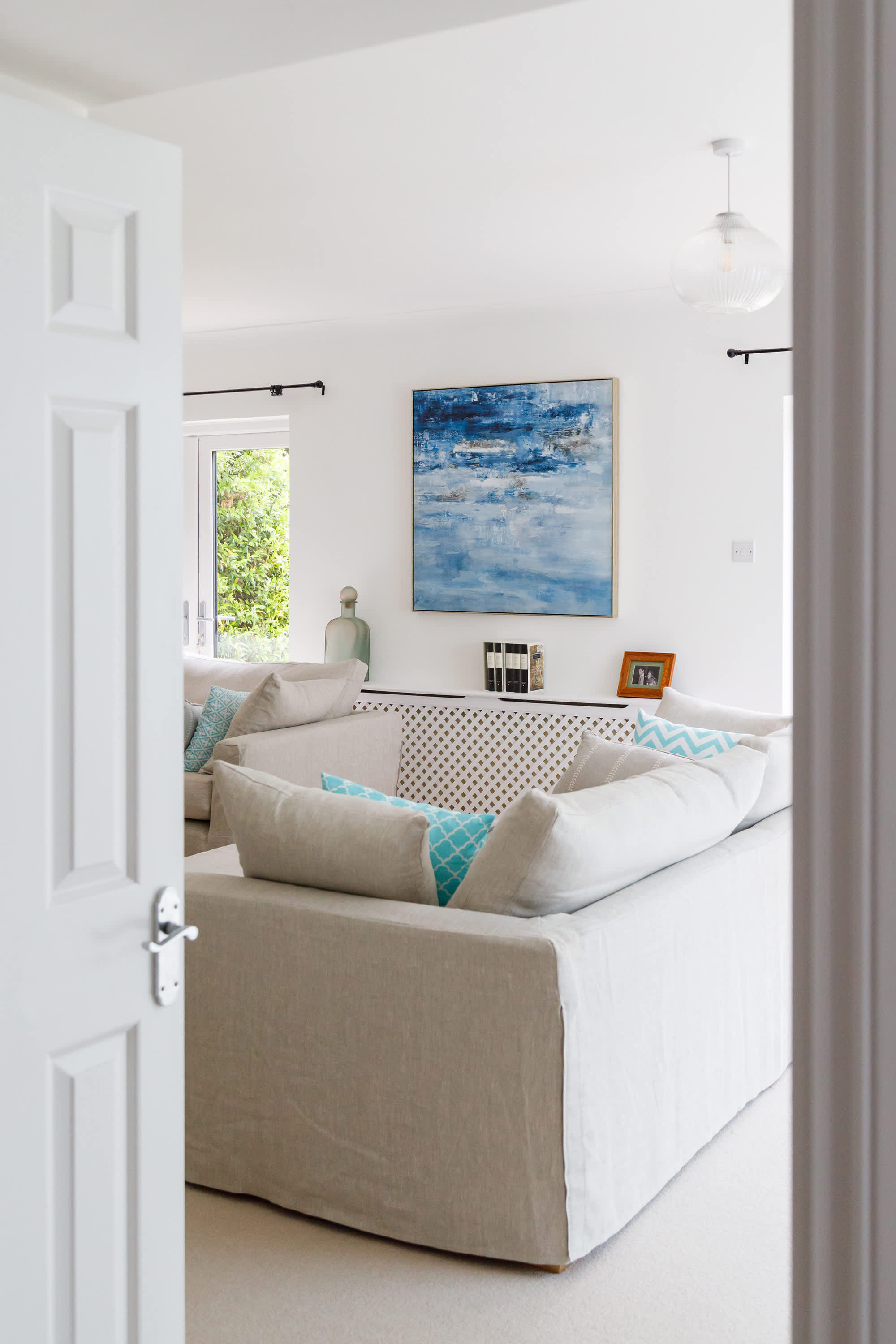 The living room features beautiful art work.