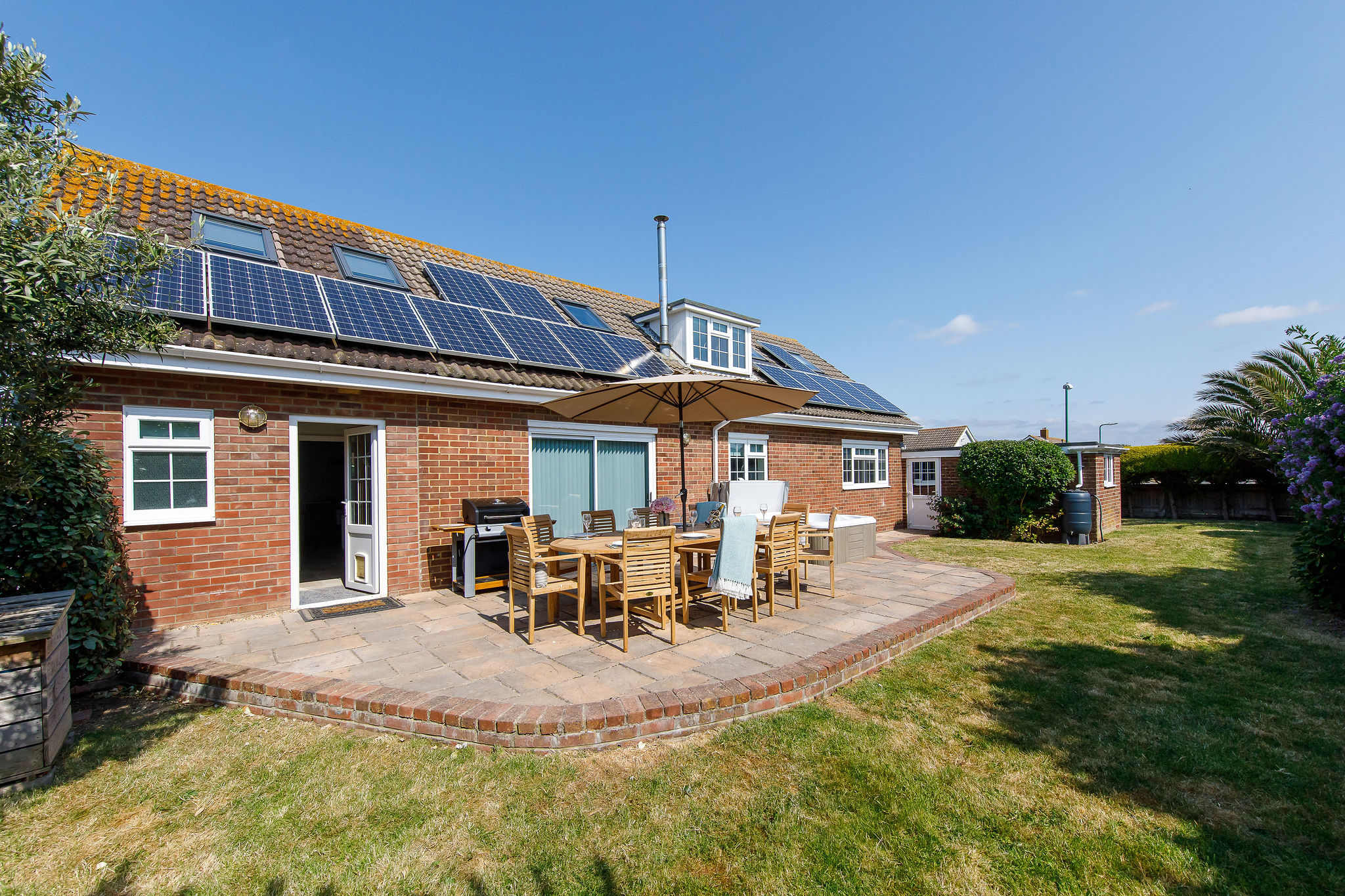 The home has a great outdoor space, with lawn, patio, hot tub, BBQ and dining furniture. What more could you want?