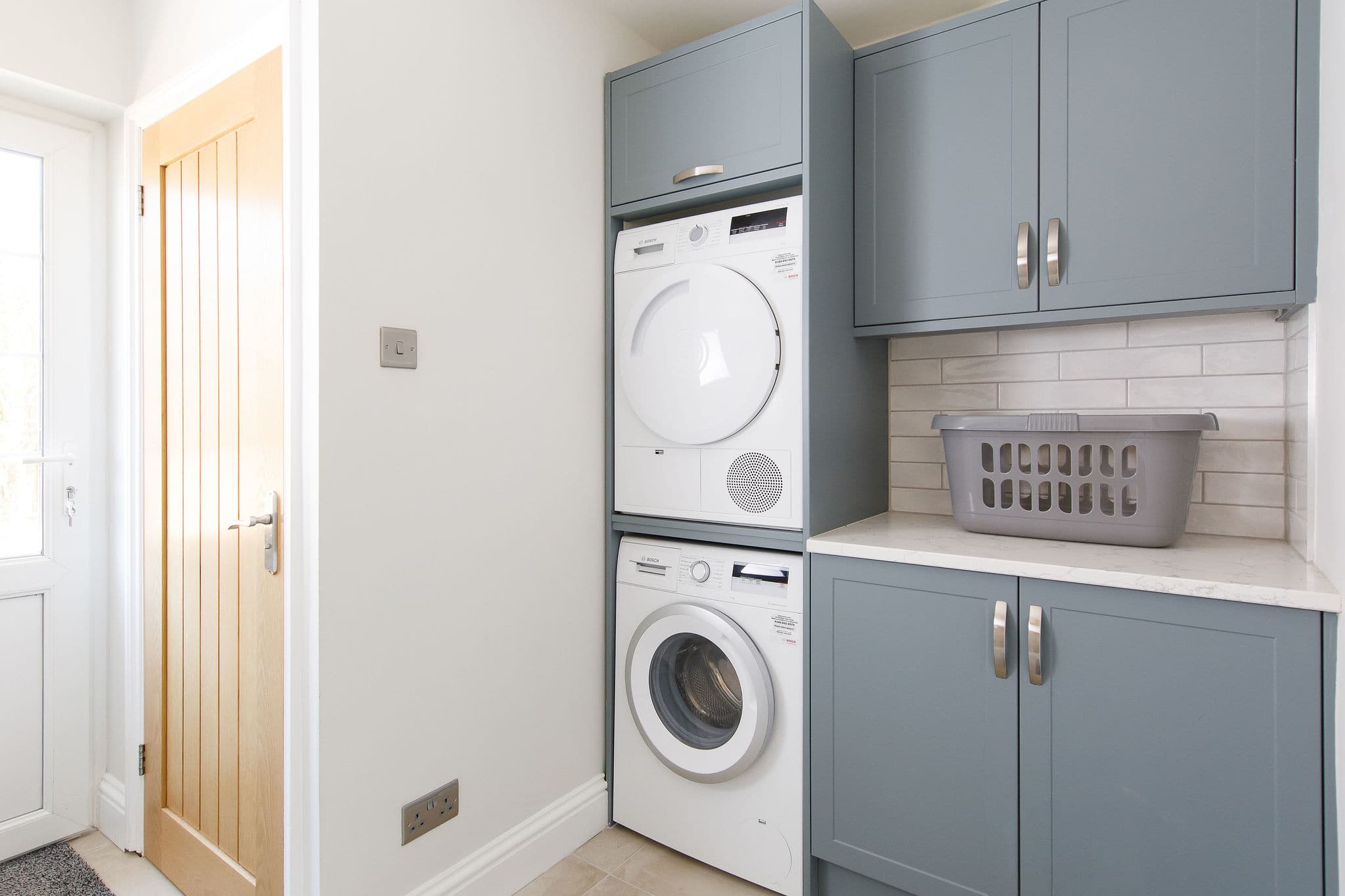 The handy utility room has a washer and dryer.