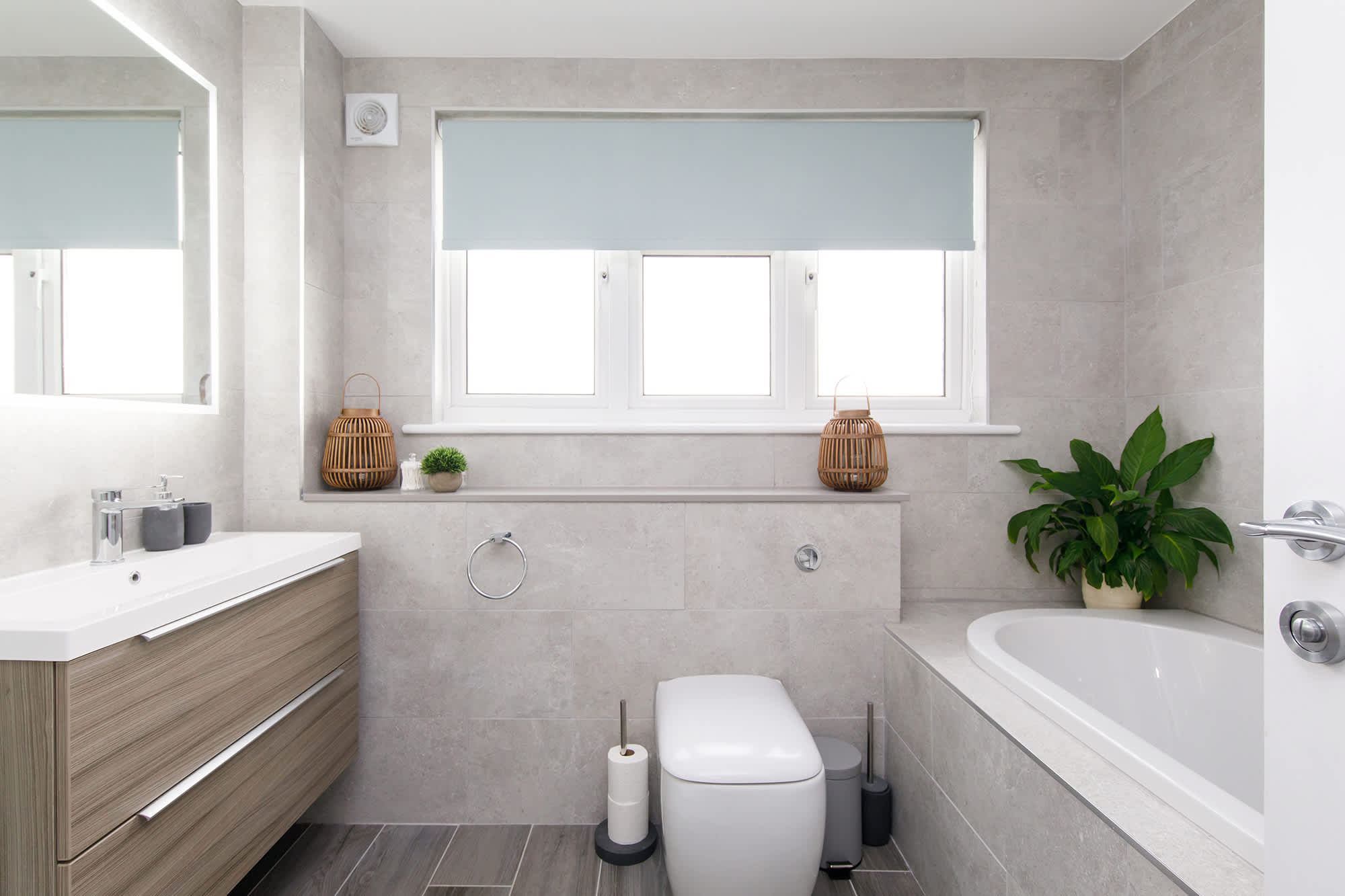 The modern family bathroom has a bath, separate shower, WC and sink.