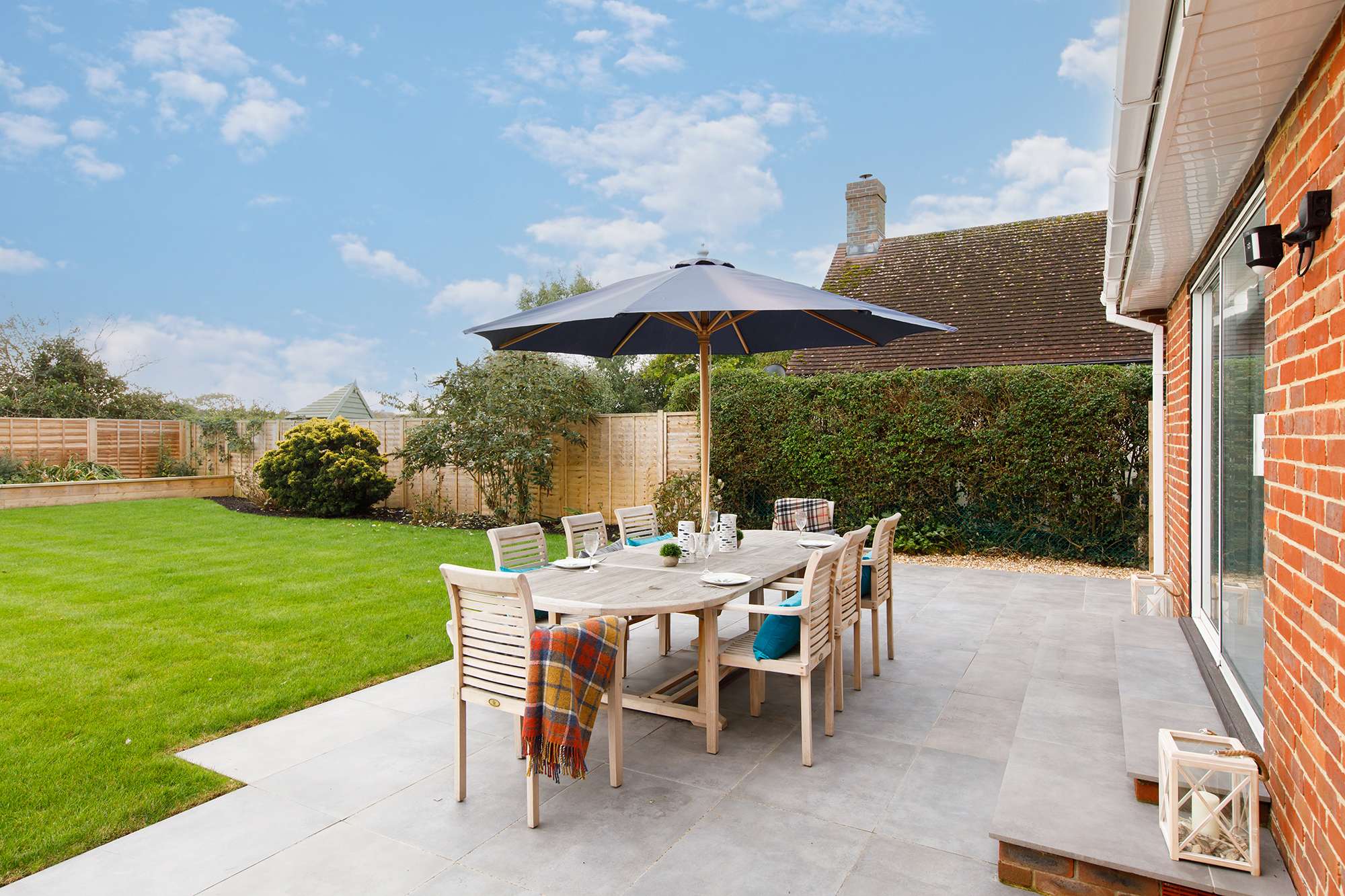 The living room doors open up to the patio, perfect for BBQs or drinks.