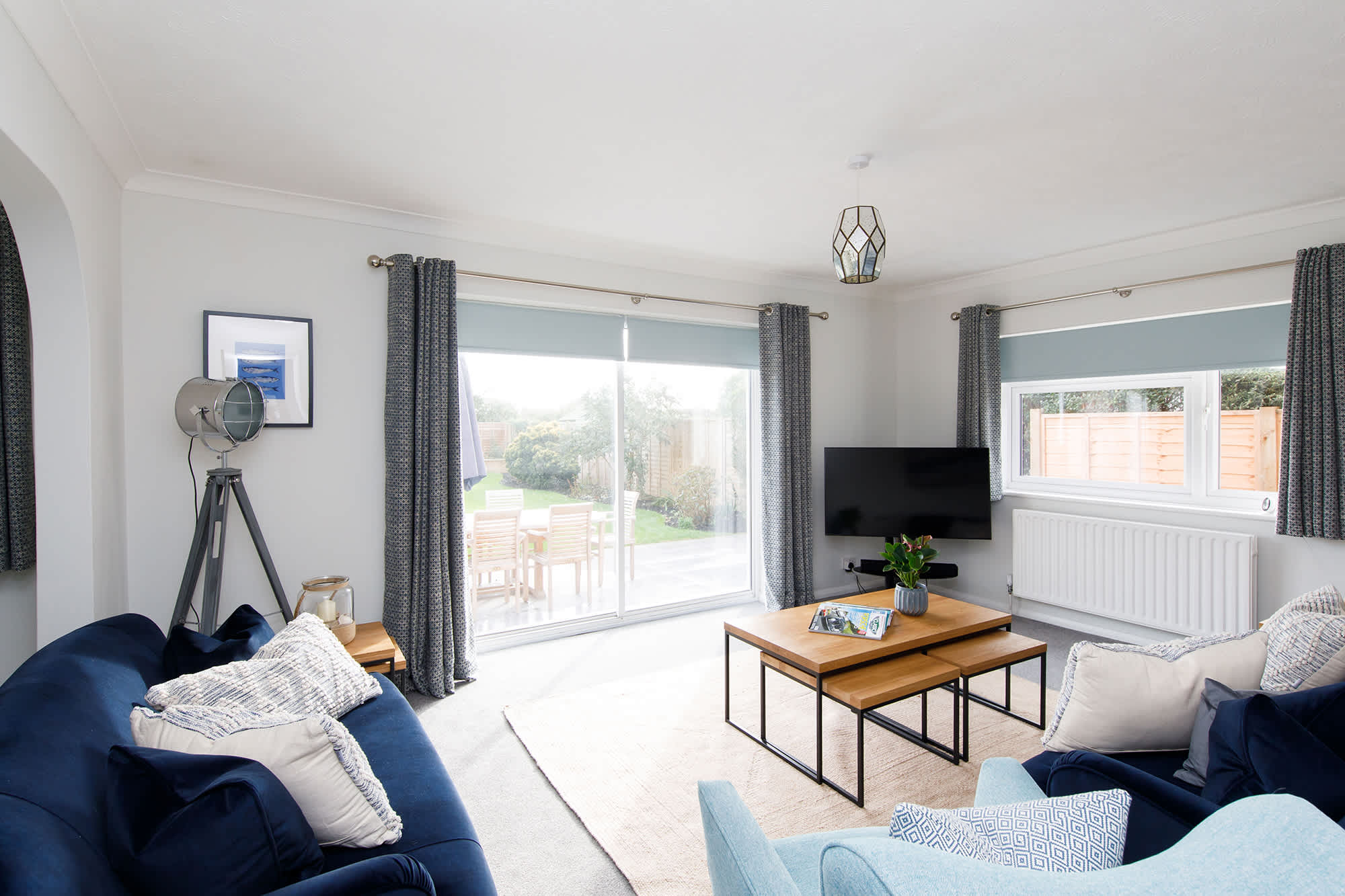 The stylish but cosy lounge has two comfy sofas and an armchair for ultimate relaxation.