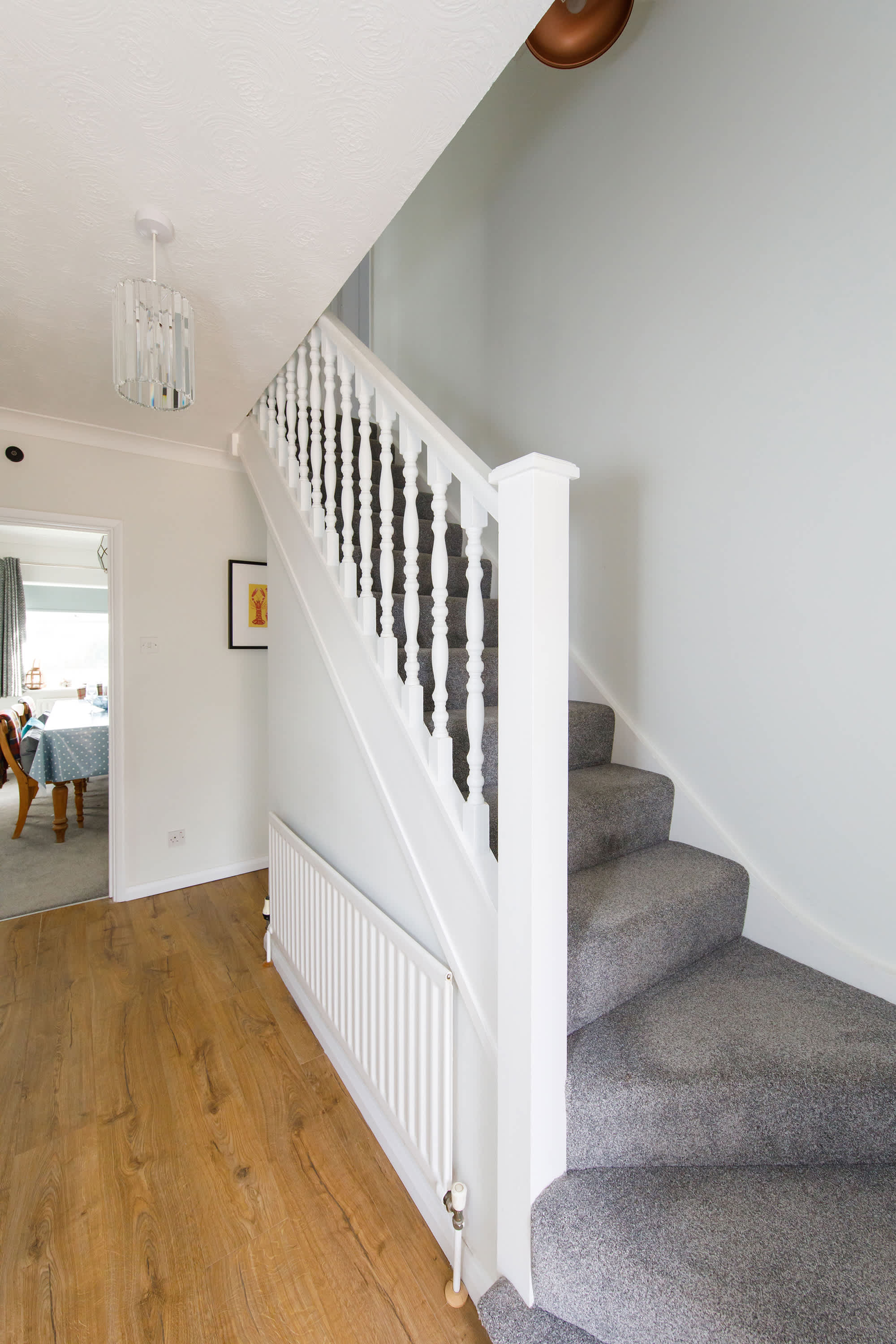 The home spreads across two floors, with two bedrooms downstairs and two upstairs.