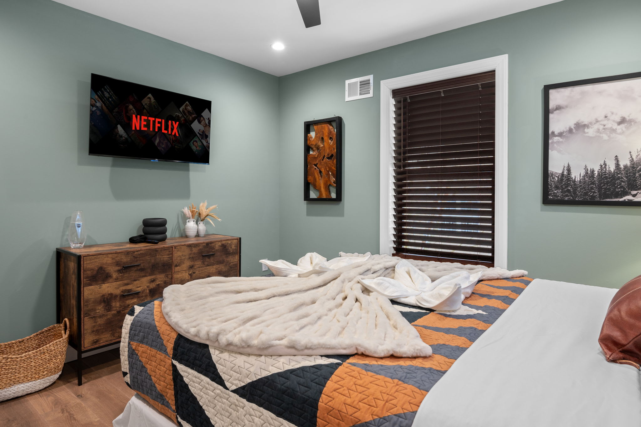 Relax in bed while streaming your favorite shows in this stylish and cozy space.