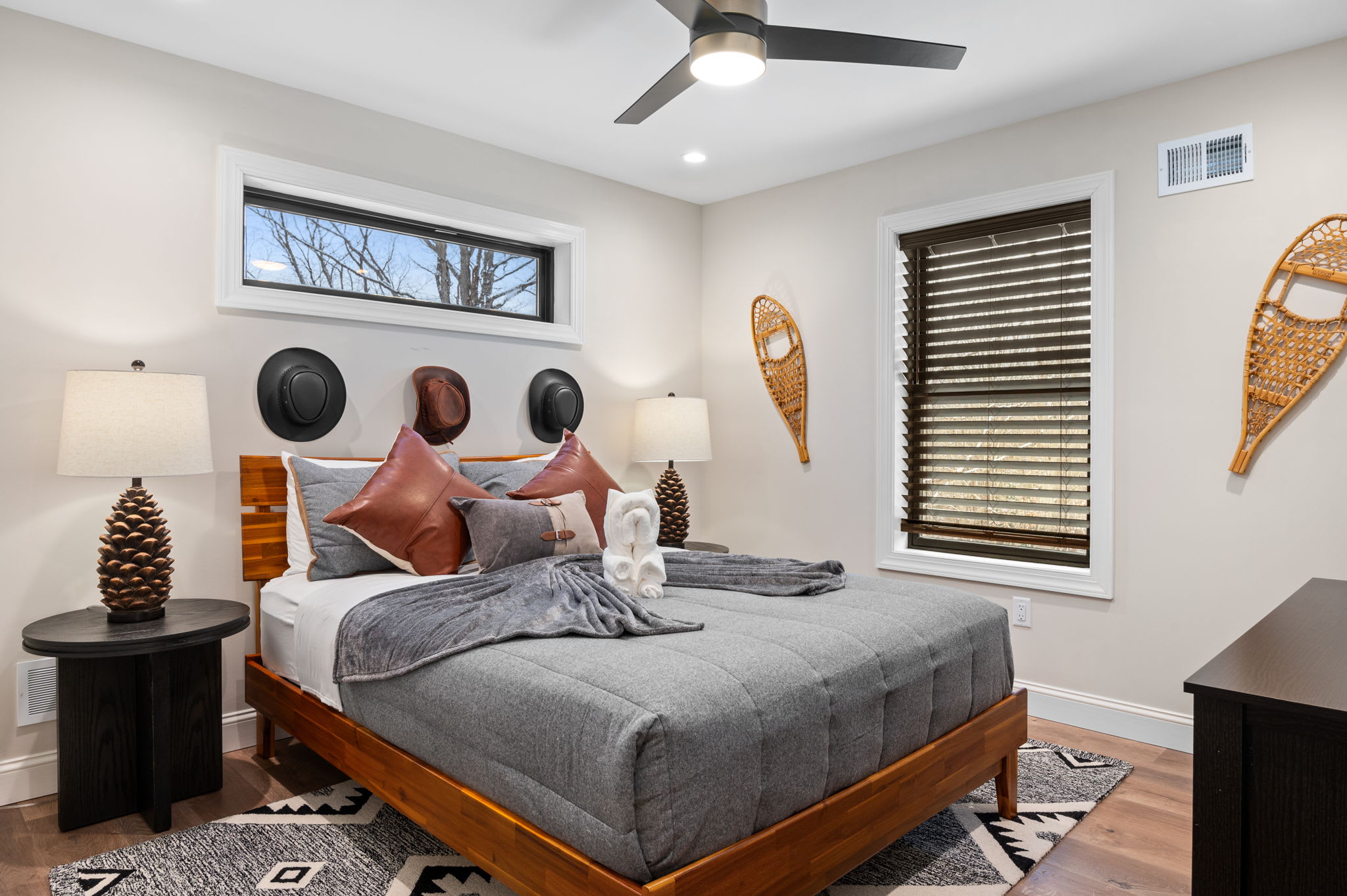 Rustic elegance meets comfort in this inviting bedroom. Earthy tones, unique decor, and soft lighting create a warm, relaxing ambiance.