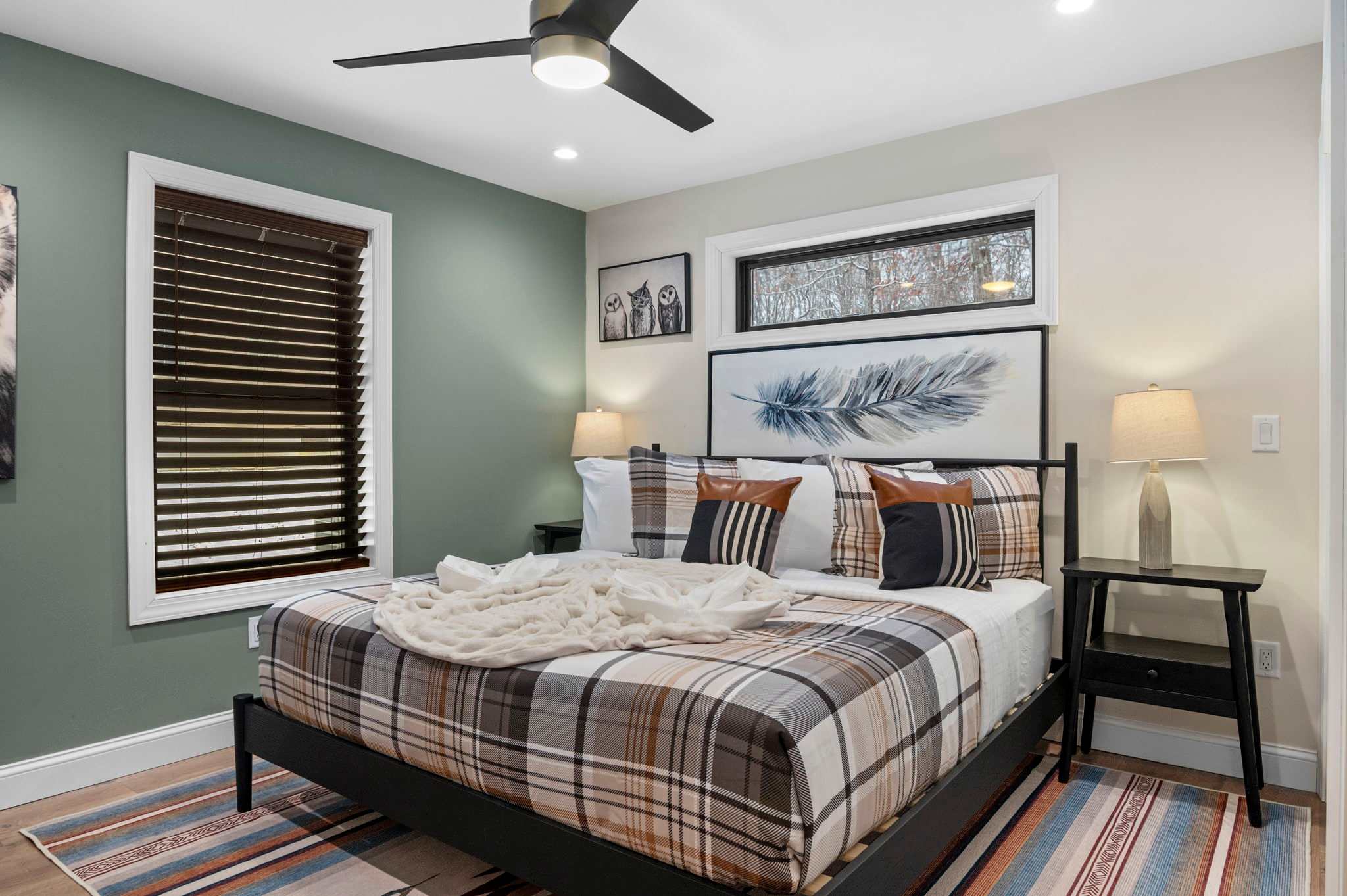 In Bedroom 2, a king bed with layered textures and nature-inspired accents promises both comfort and style for your getaway.