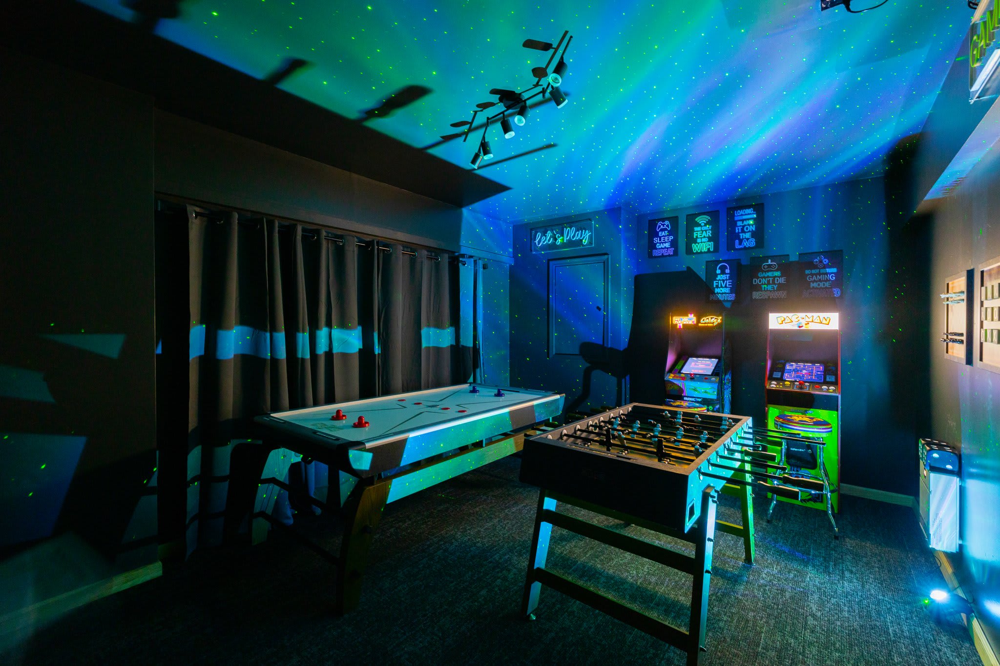 Glow Game Room Magic
Arcade classics, foosball, and glowing galaxy lights this room is made for epic game nights and nonstop fun.