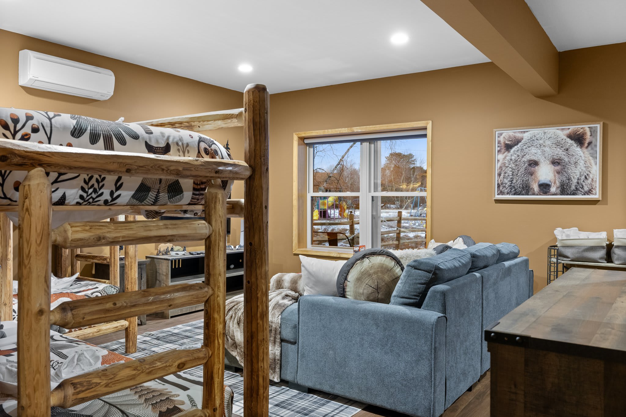Sleepover-Ready Setup
With comfy log-frame bunks and tons of seating, this bedroom is ready for memory-making moments.