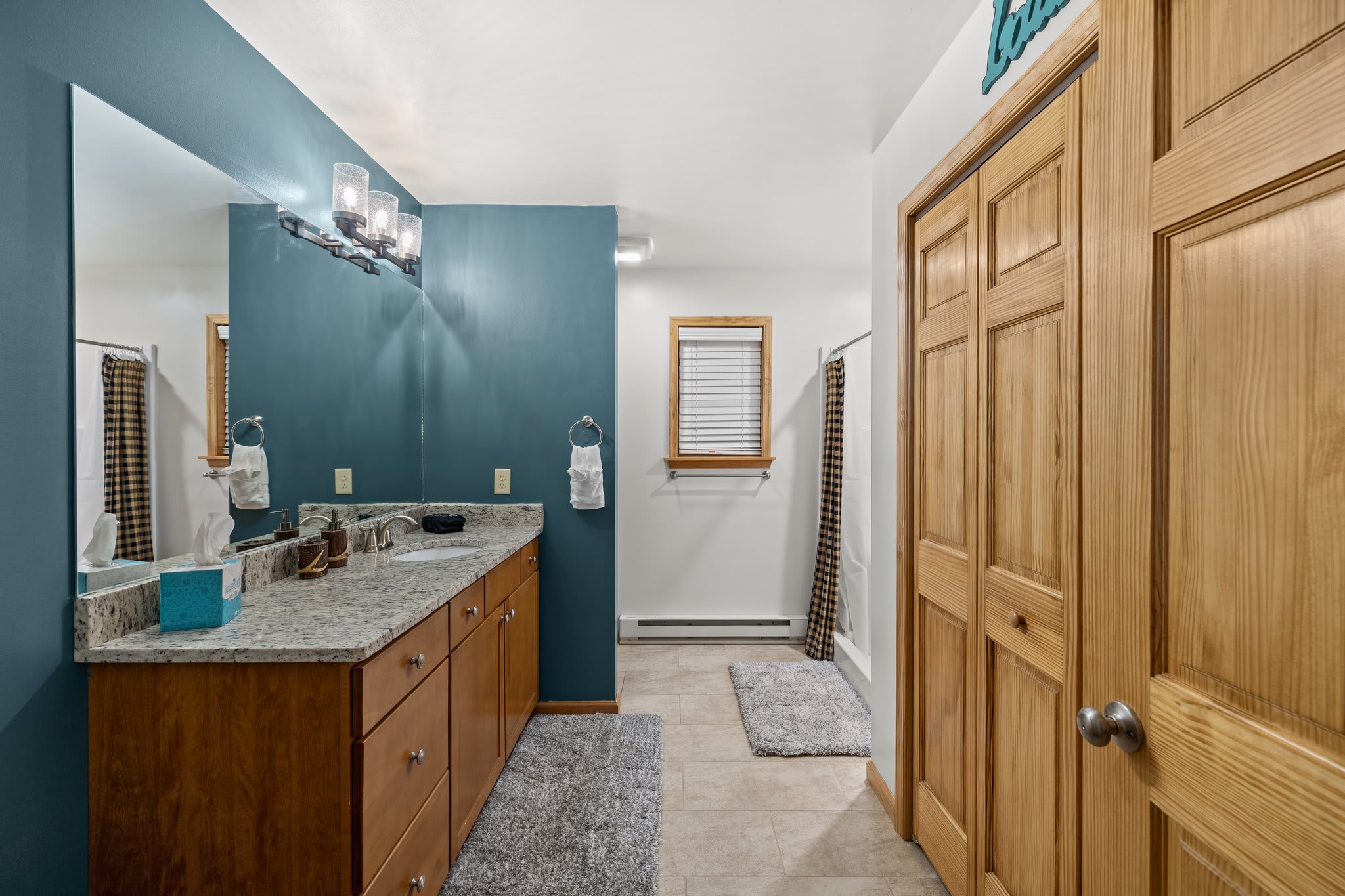 Plush towels, a walk-in shower, and charming touches give you that boutique stay feel, with plenty of elbow room.