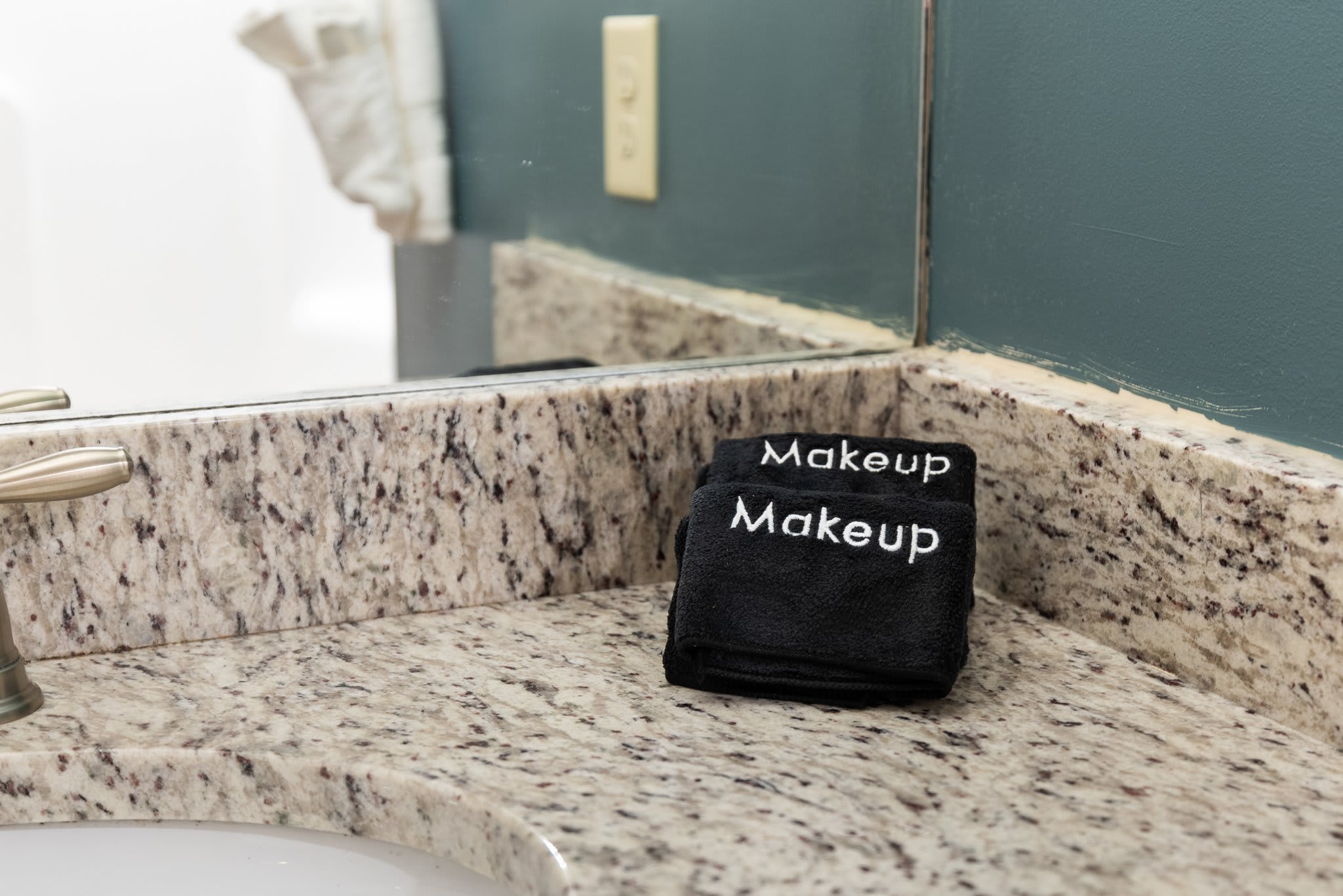 A cute vanity setup with a little black towel that says it all. It’s the little touches that make you feel at home.