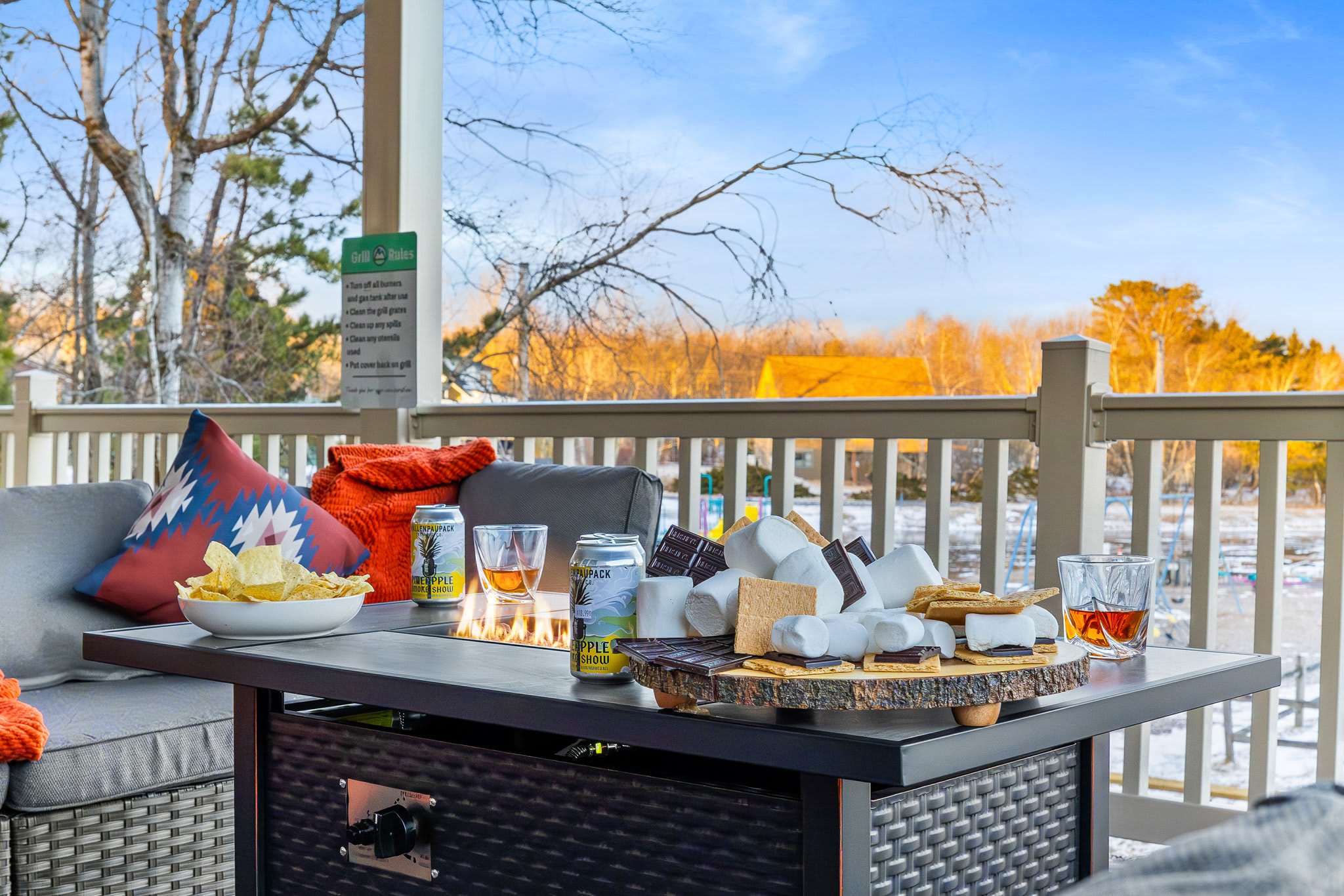 A dreamy daytime version of the fire table setup with pastries, coffee, and sunshine all around.