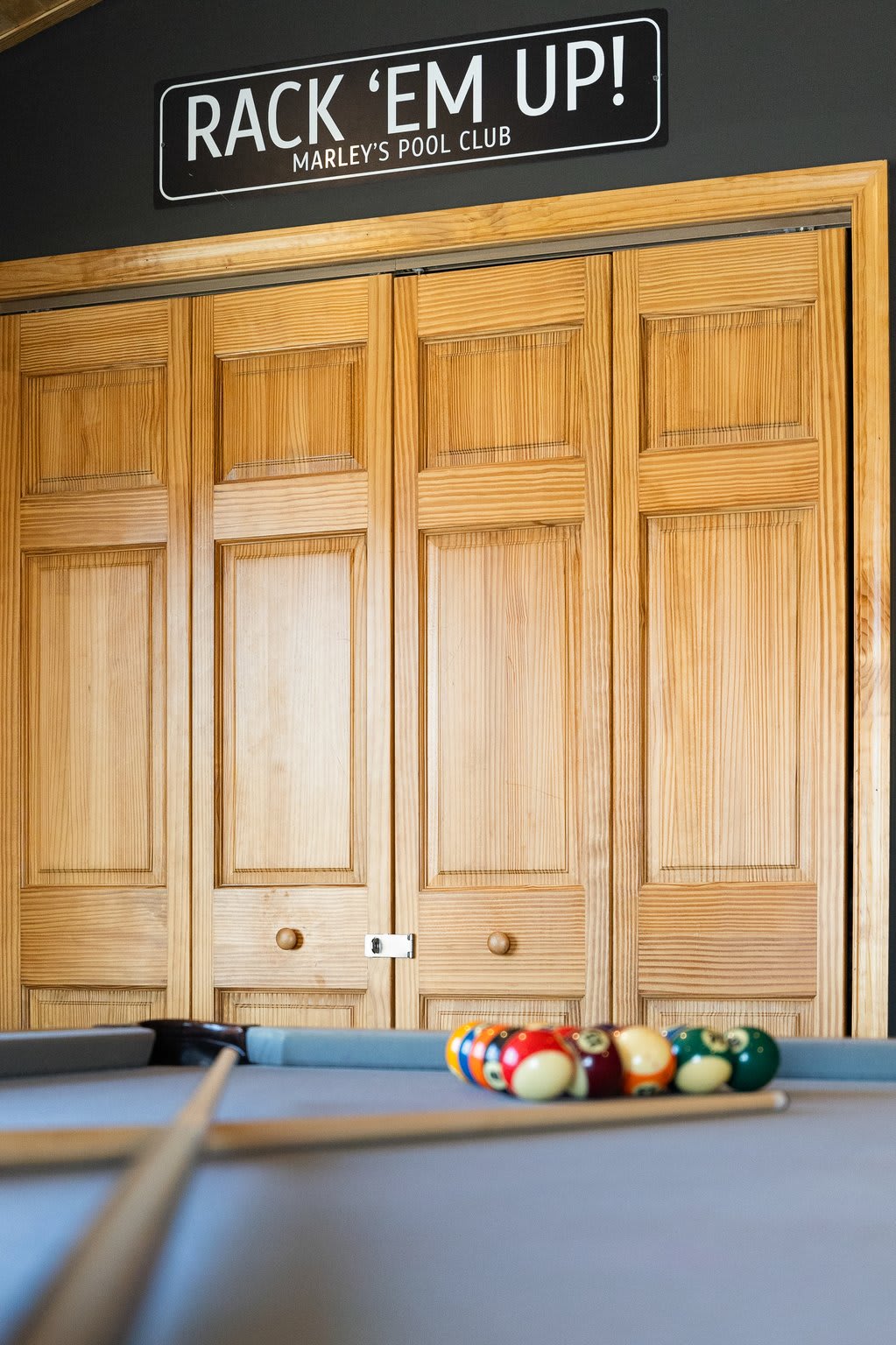 This fun nook boasts a “Rack ’Em Up” sign and a perfect spot, ready for your next game.