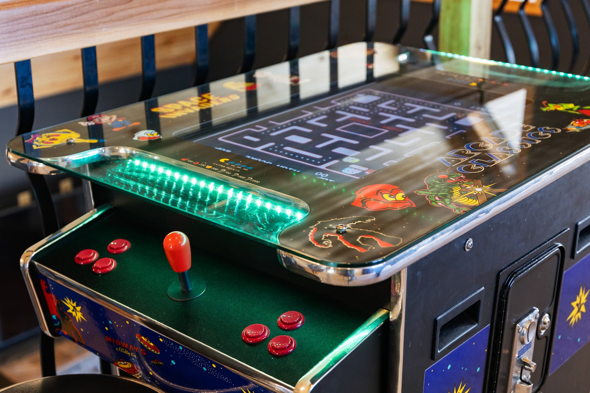 A throwback classic! Neon-lit arcade table with Pac-Man vibes for that nostalgic late-night challenge.
