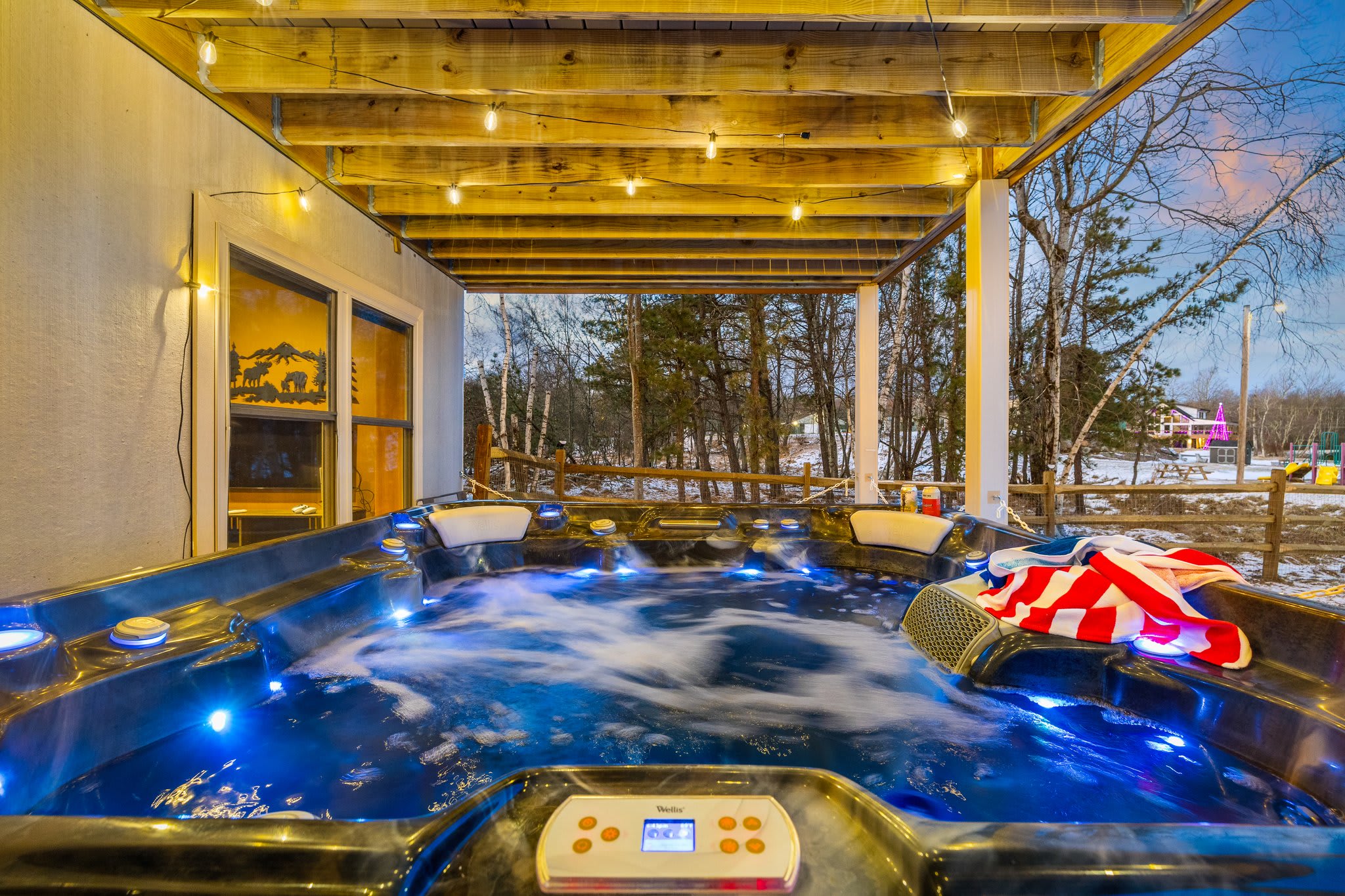 LED-lit jets and fairy lights overhead make this hot tub the ultimate evening relaxation zone.