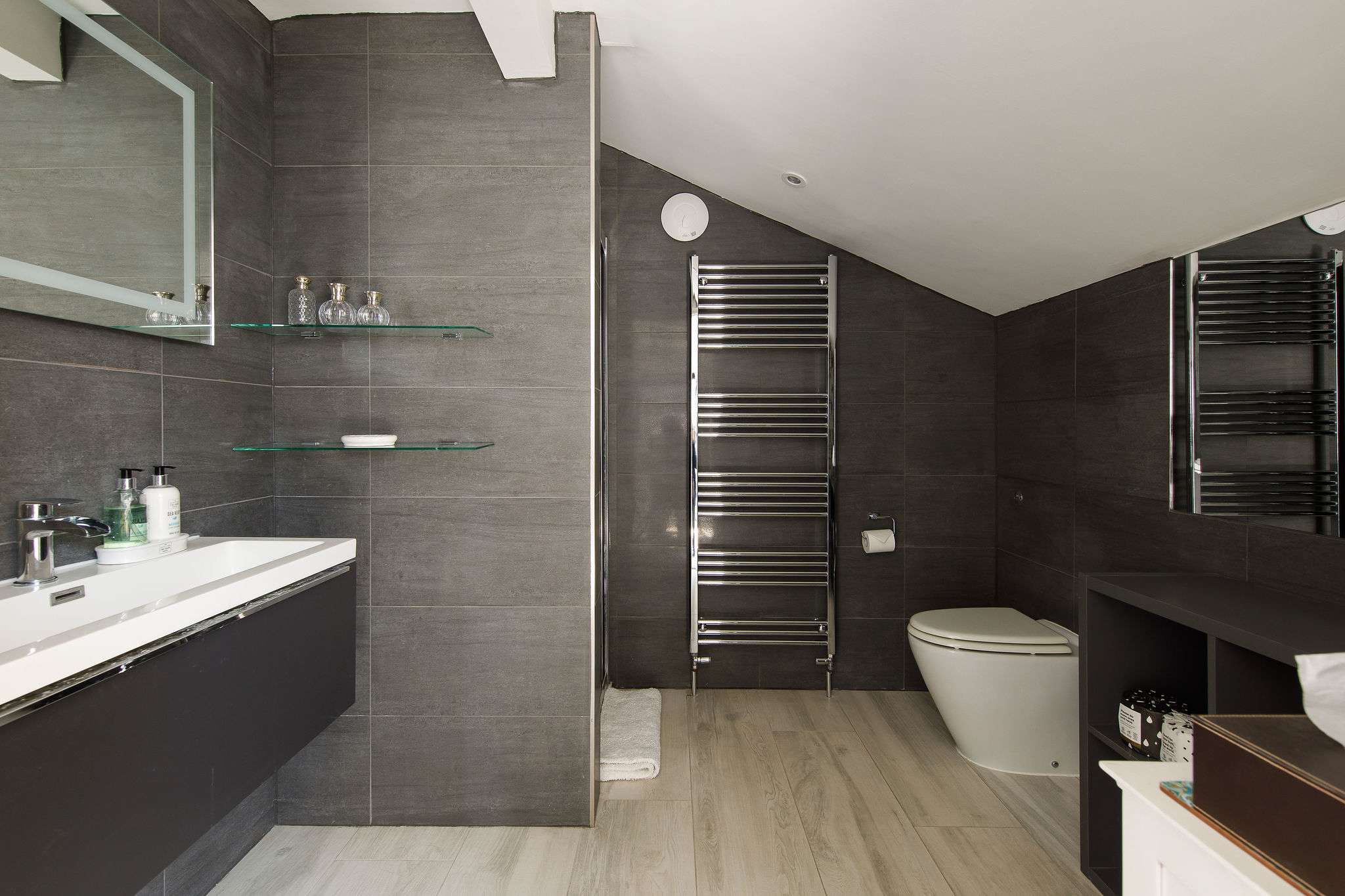 The ensuite has a huge walk-in shower, WC and sink.