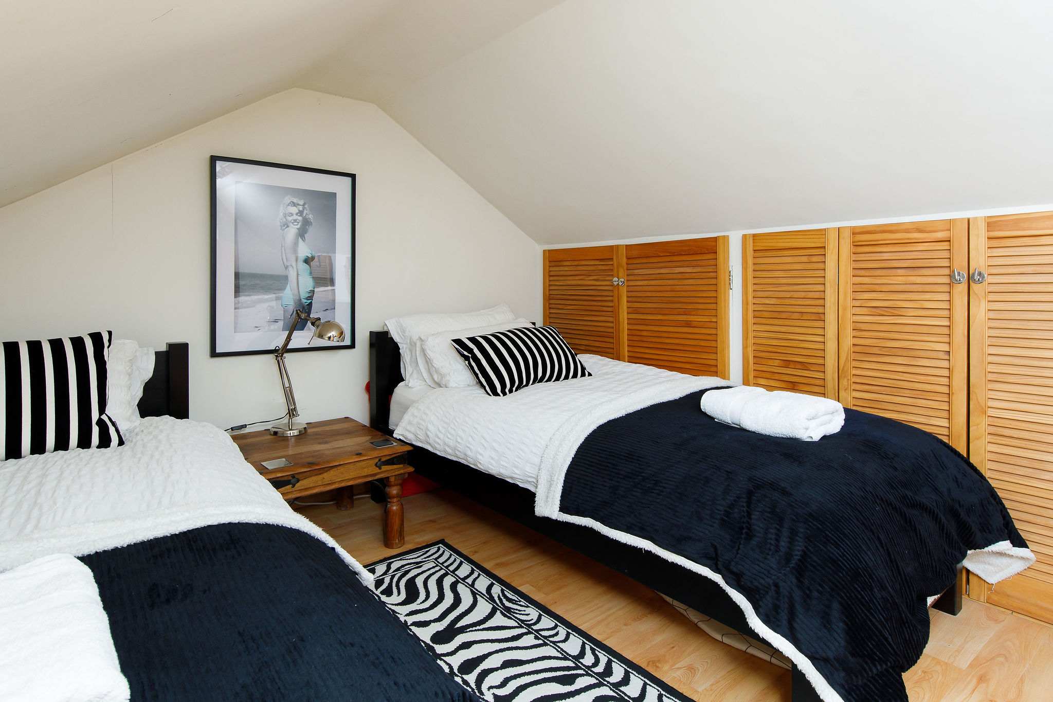 The twin has comfy mattresses and luxury bedding.