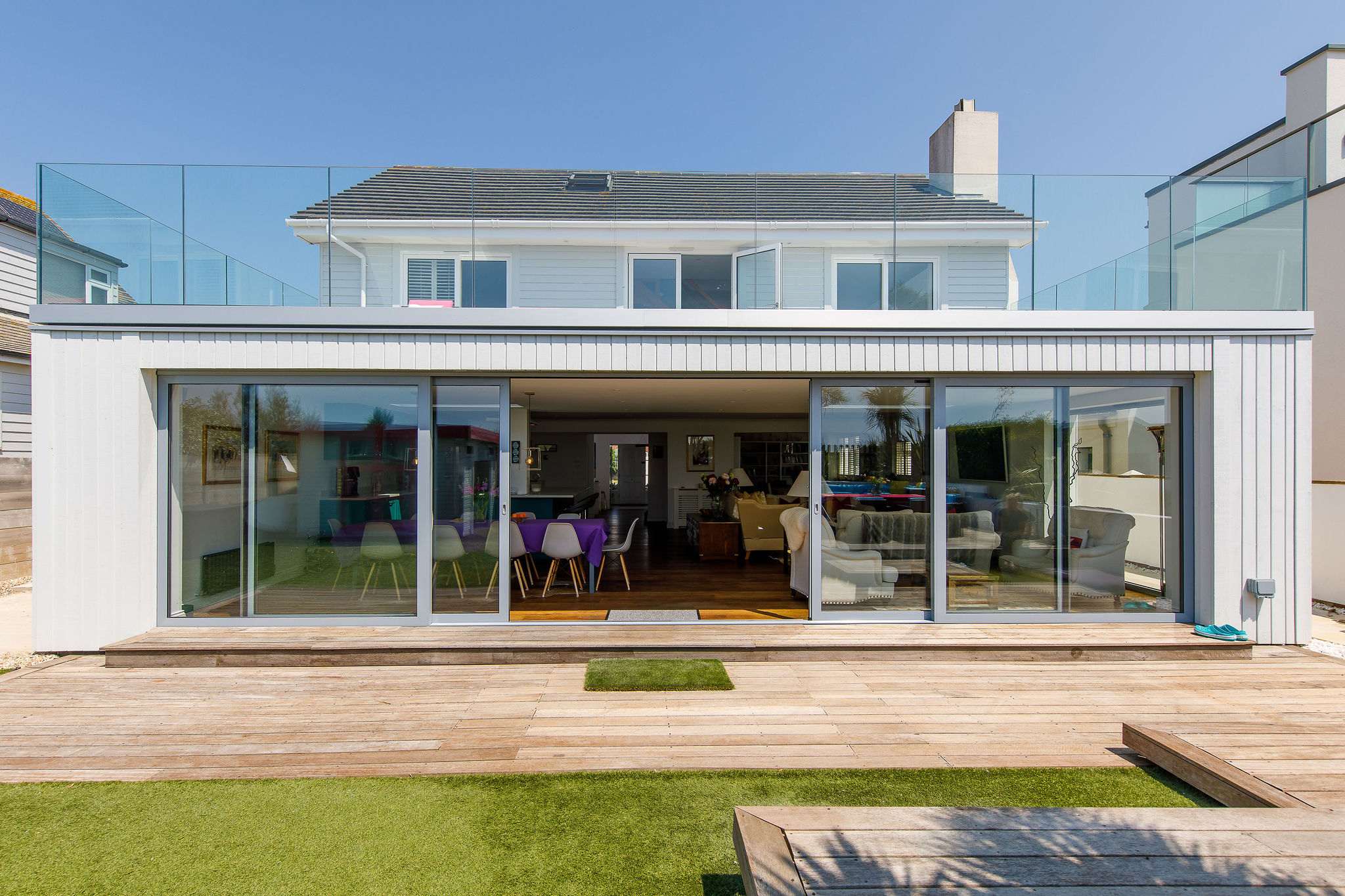 The rear of the home has large sliding patio doors to connect the home to the garden. This huge space is great for entertaining and dining with the whole family.