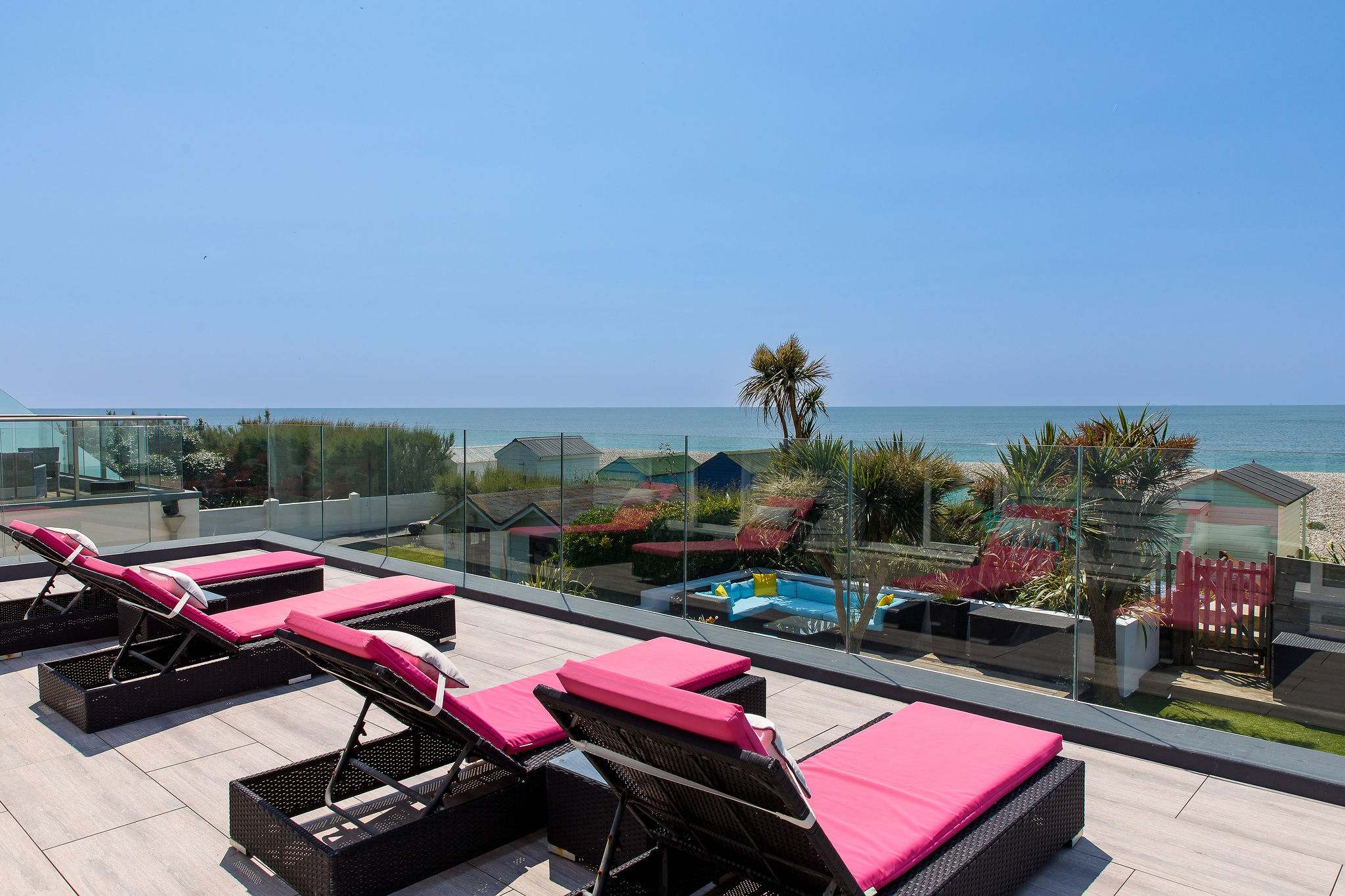 Soak up the sun on the balcony as you enjoy sea views.