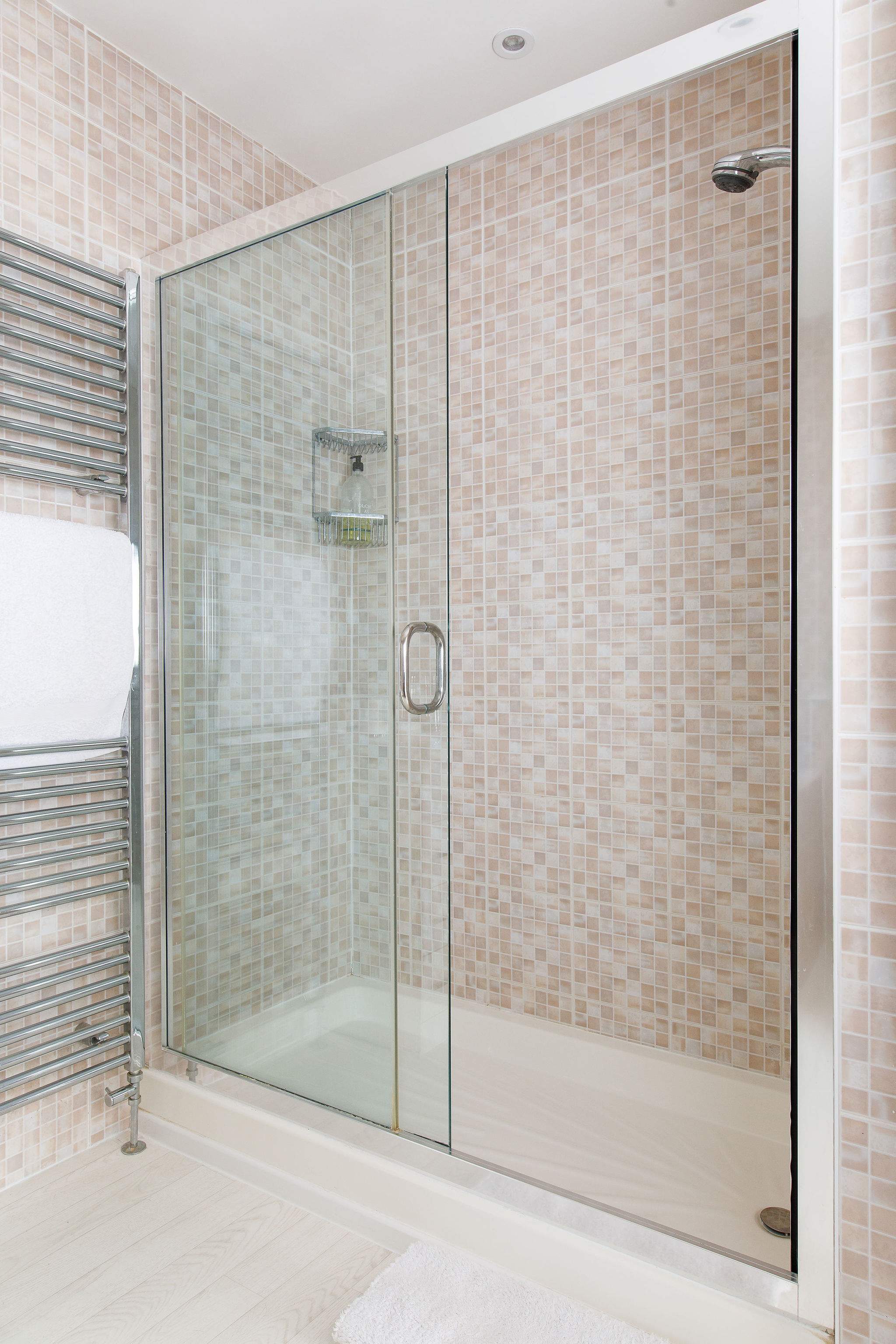 The family bathroom has a large separate shower.