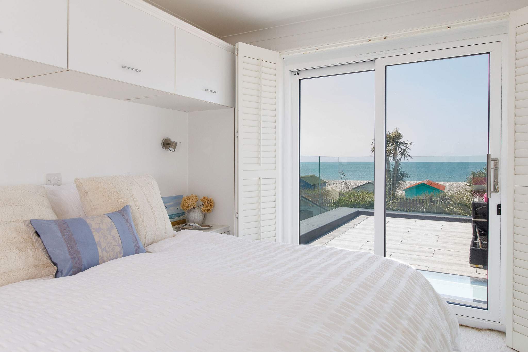 Two of the bedrooms have balcony access and magnificent sea views.