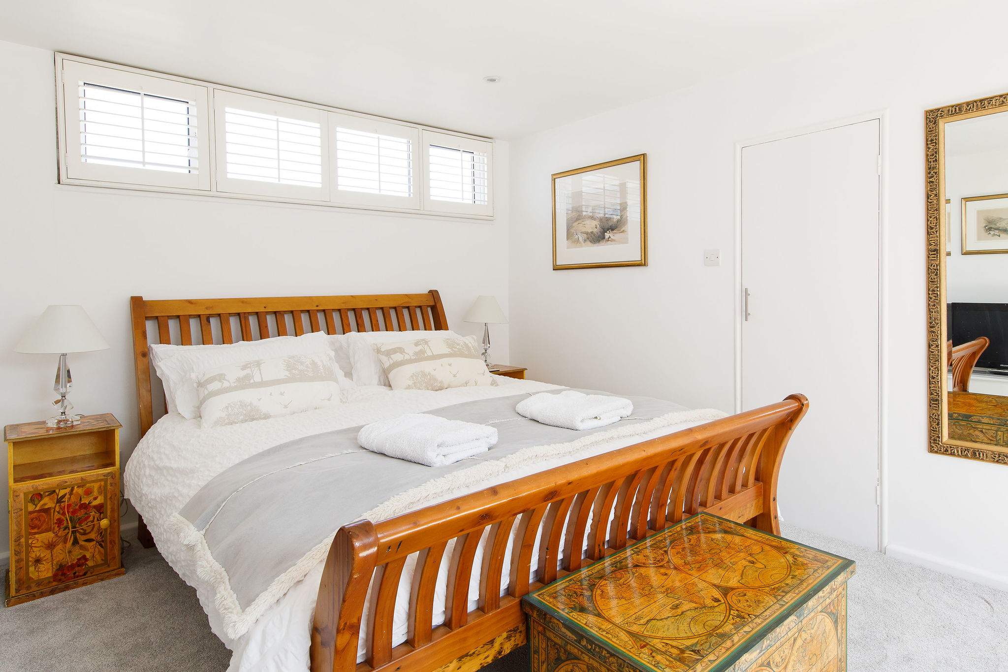 The second king has a comfy sleigh bed with luxurious bedding and linen.