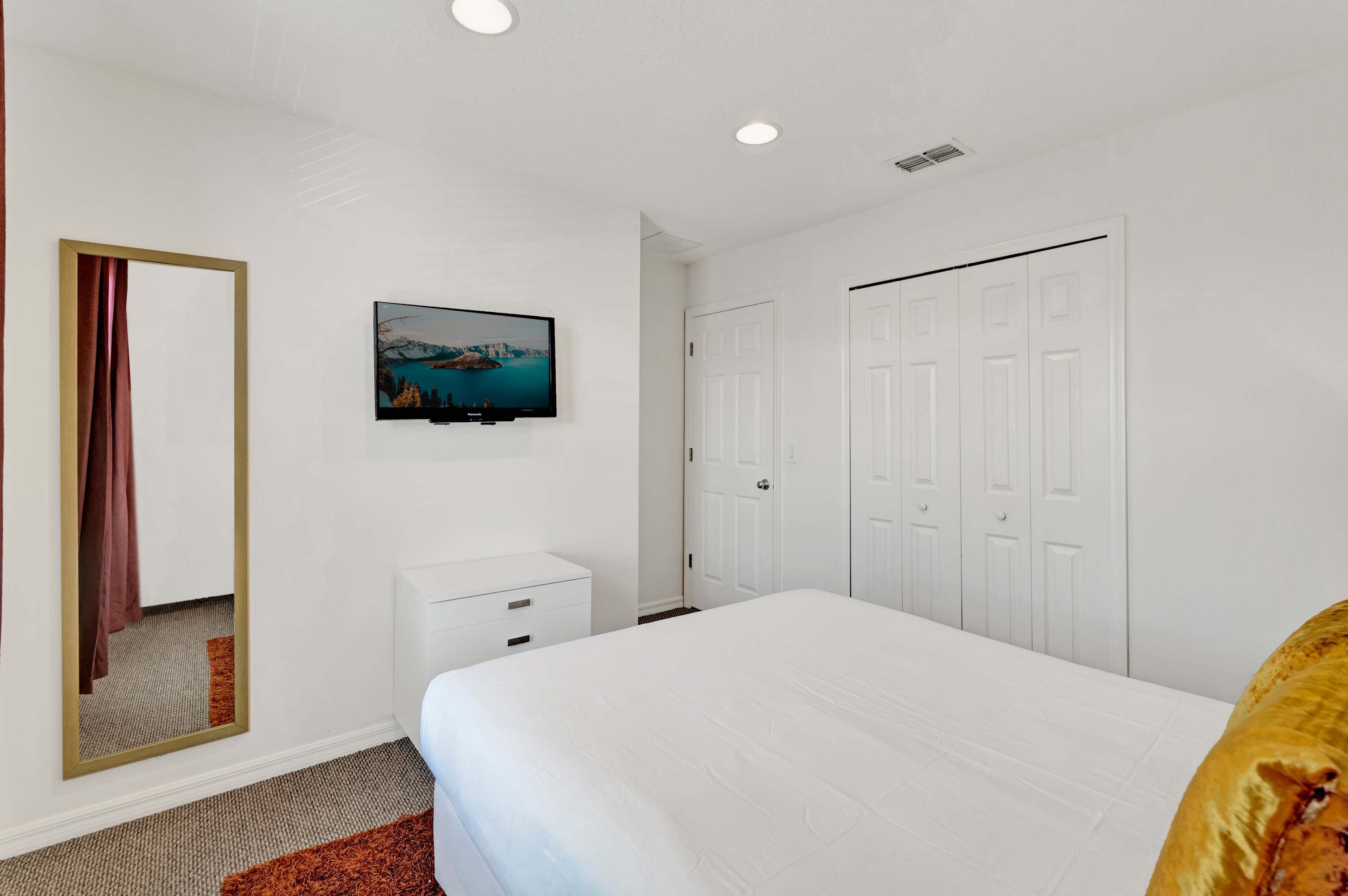 Queen bedroom with smart TV