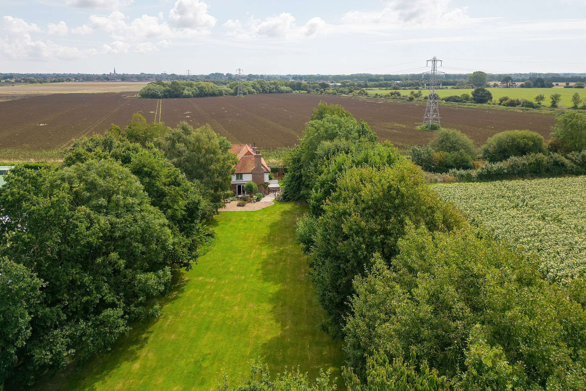 The home is surrounded by stunning countryside and farmland.