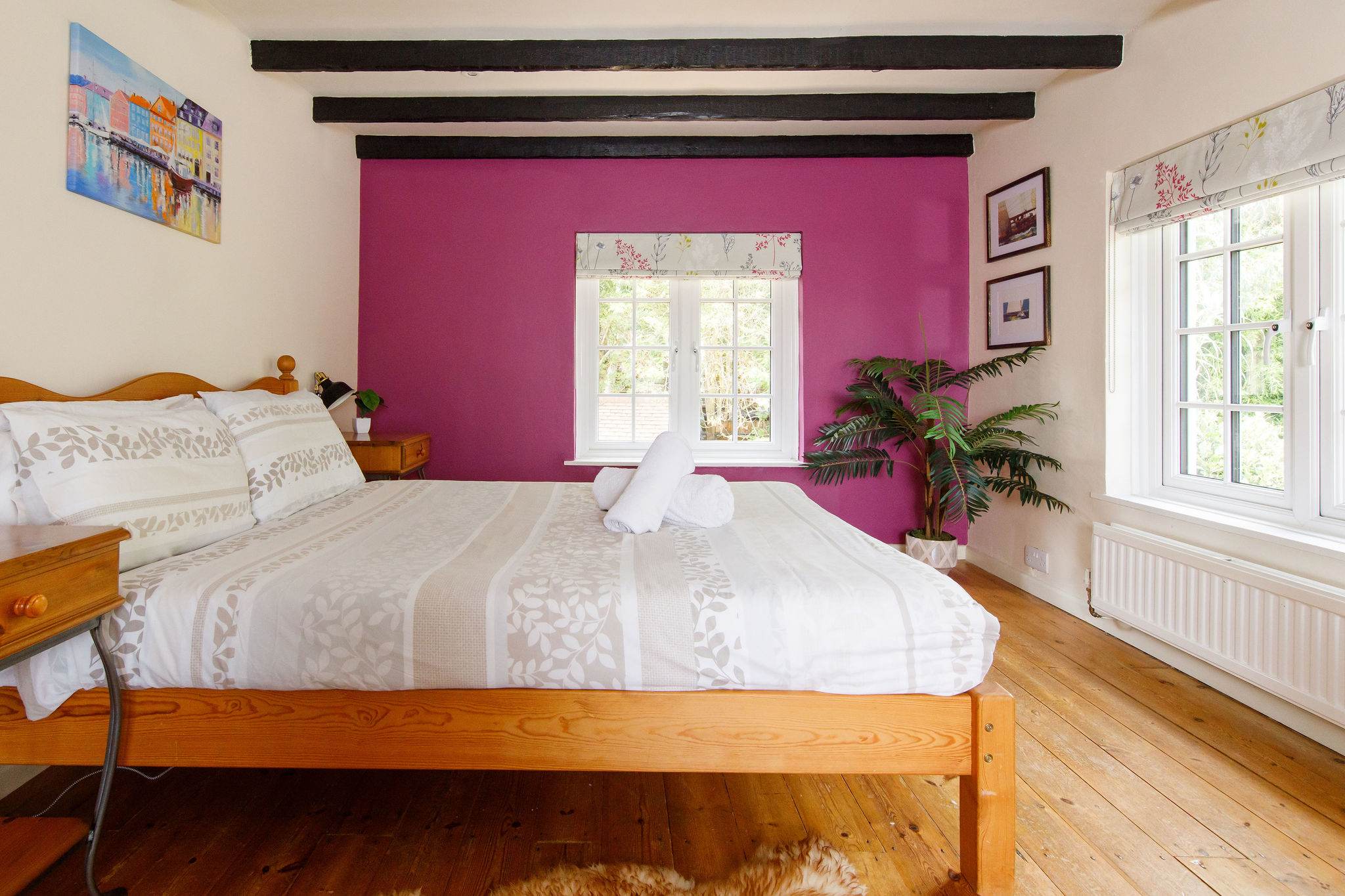 This double is full of cottage charm, with wooden beams and patterned fabrics.
