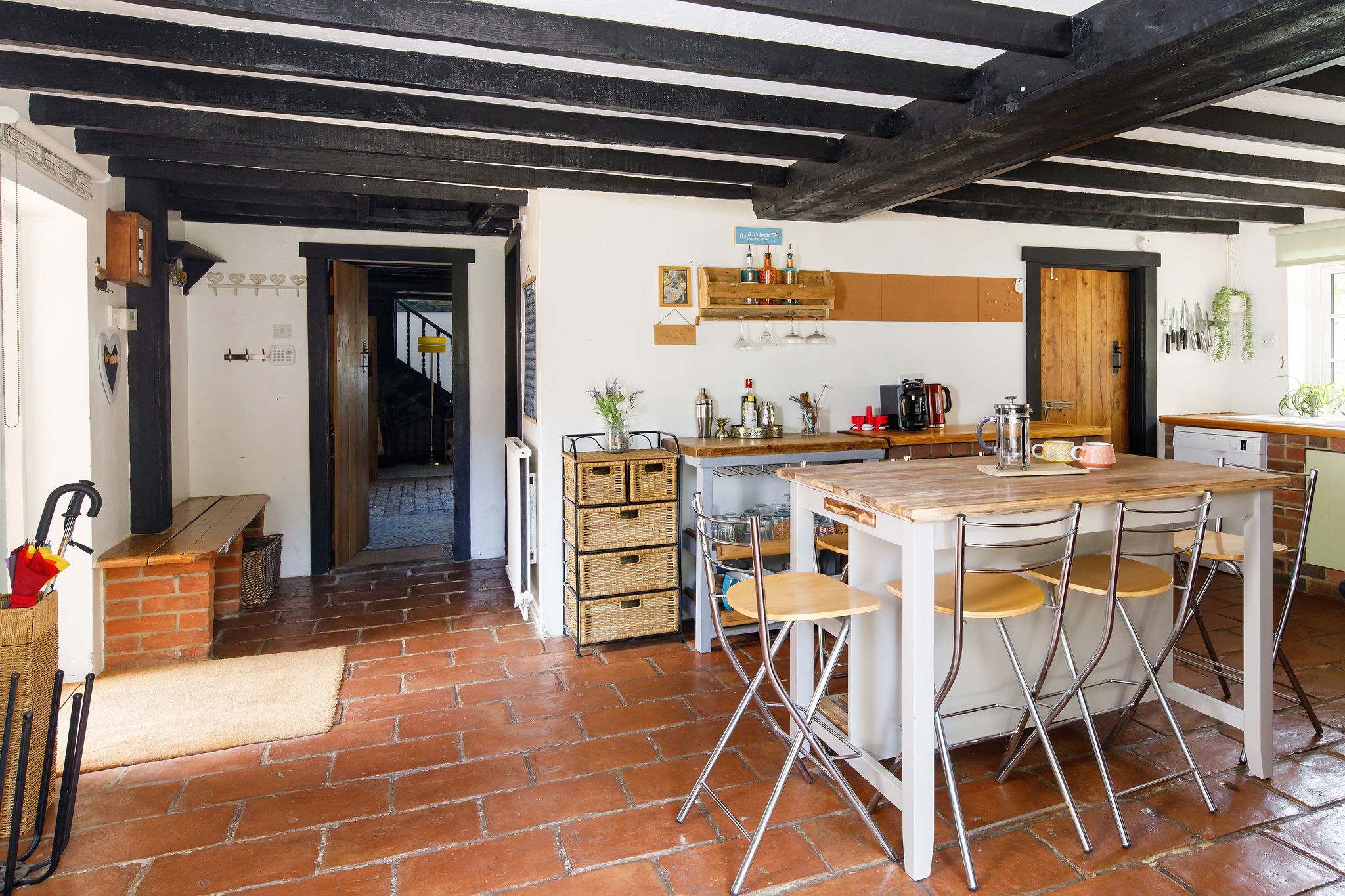 Enjoy the cottage-style kitchen with a central island, creating a warm and inviting atmosphere.