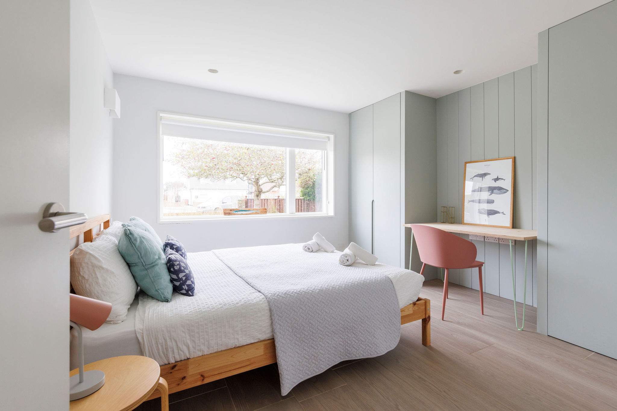 Our downstairs king bed with beautiful pastel colours