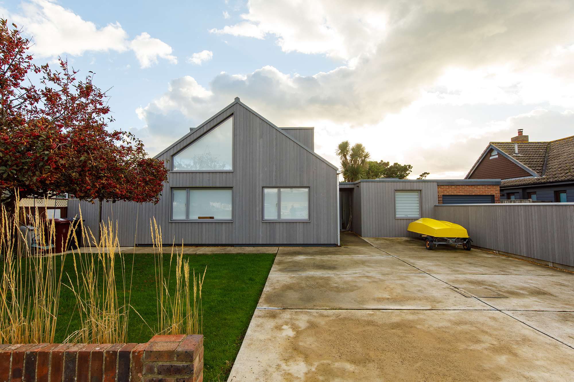 The home has a stylish and striking exterior with plenty of parking space.