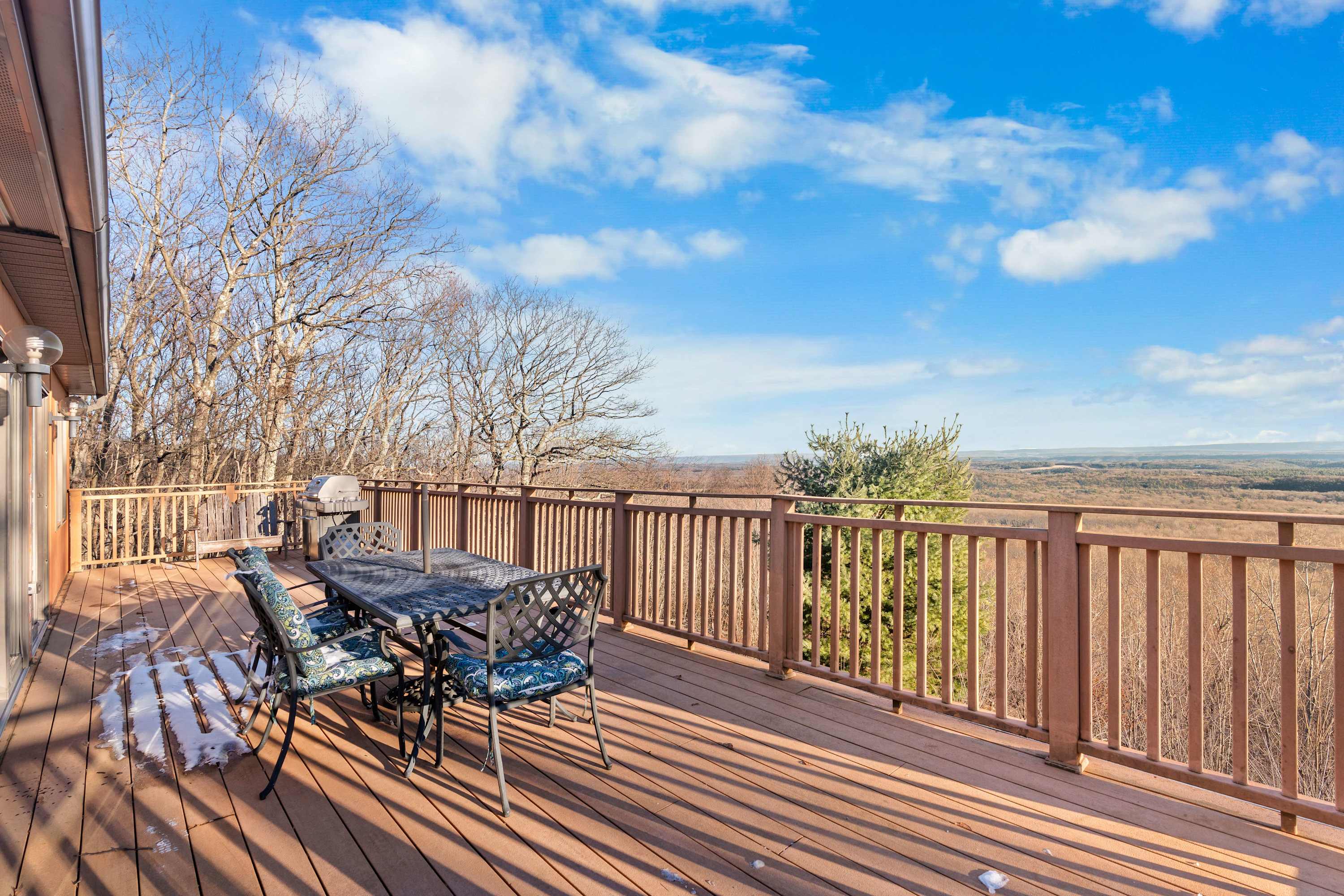 Breathtaking Views Await! – Sip your morning coffee or enjoy an evening BBQ on this spacious deck with panoramic mountain views. Perfect for your next short-term stay! 
