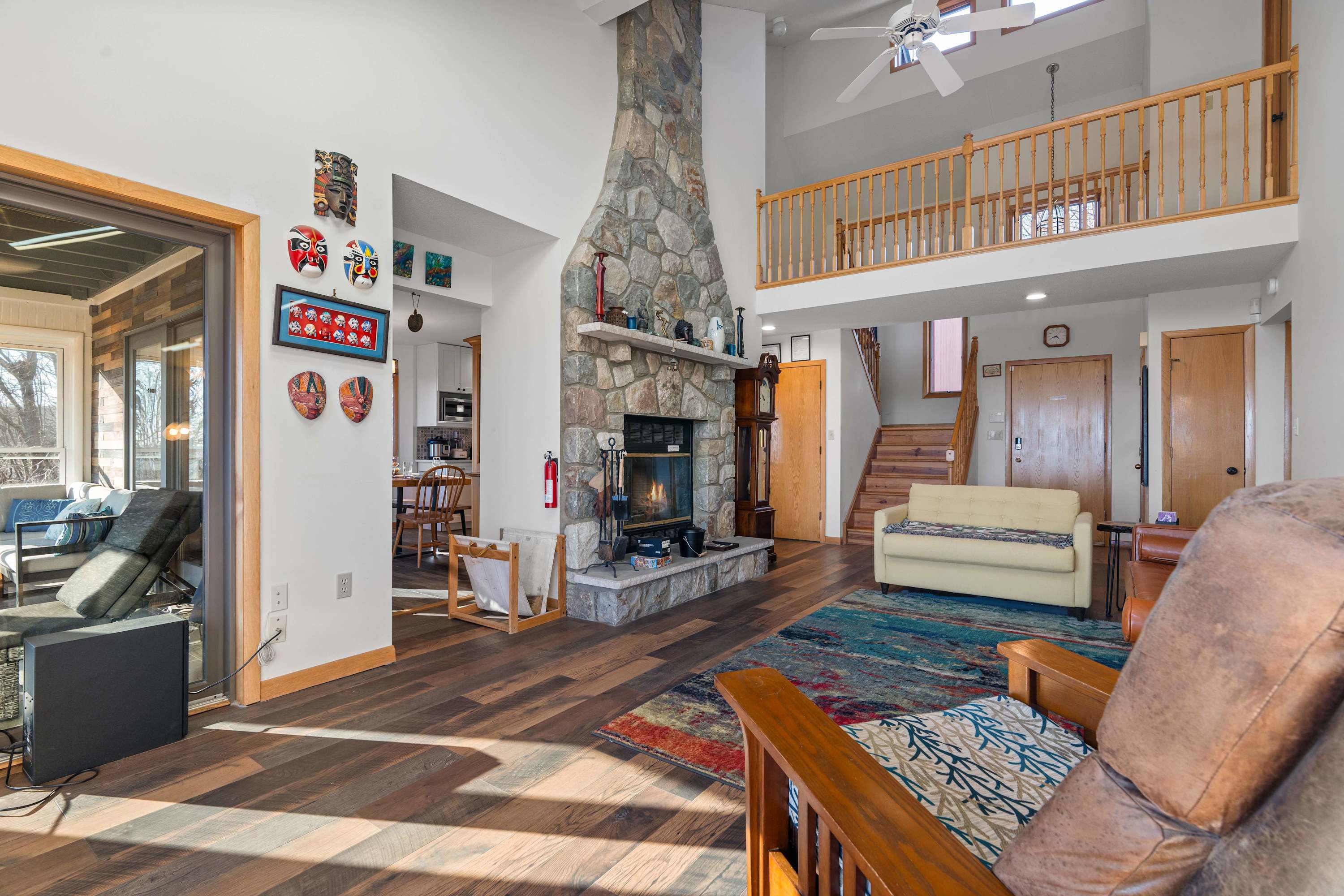 This space is a perfect blend of rustic charm and modern comfort! The open-concept layout, cozy fireplace, and high ceilings create a warm and inviting atmosphere. 