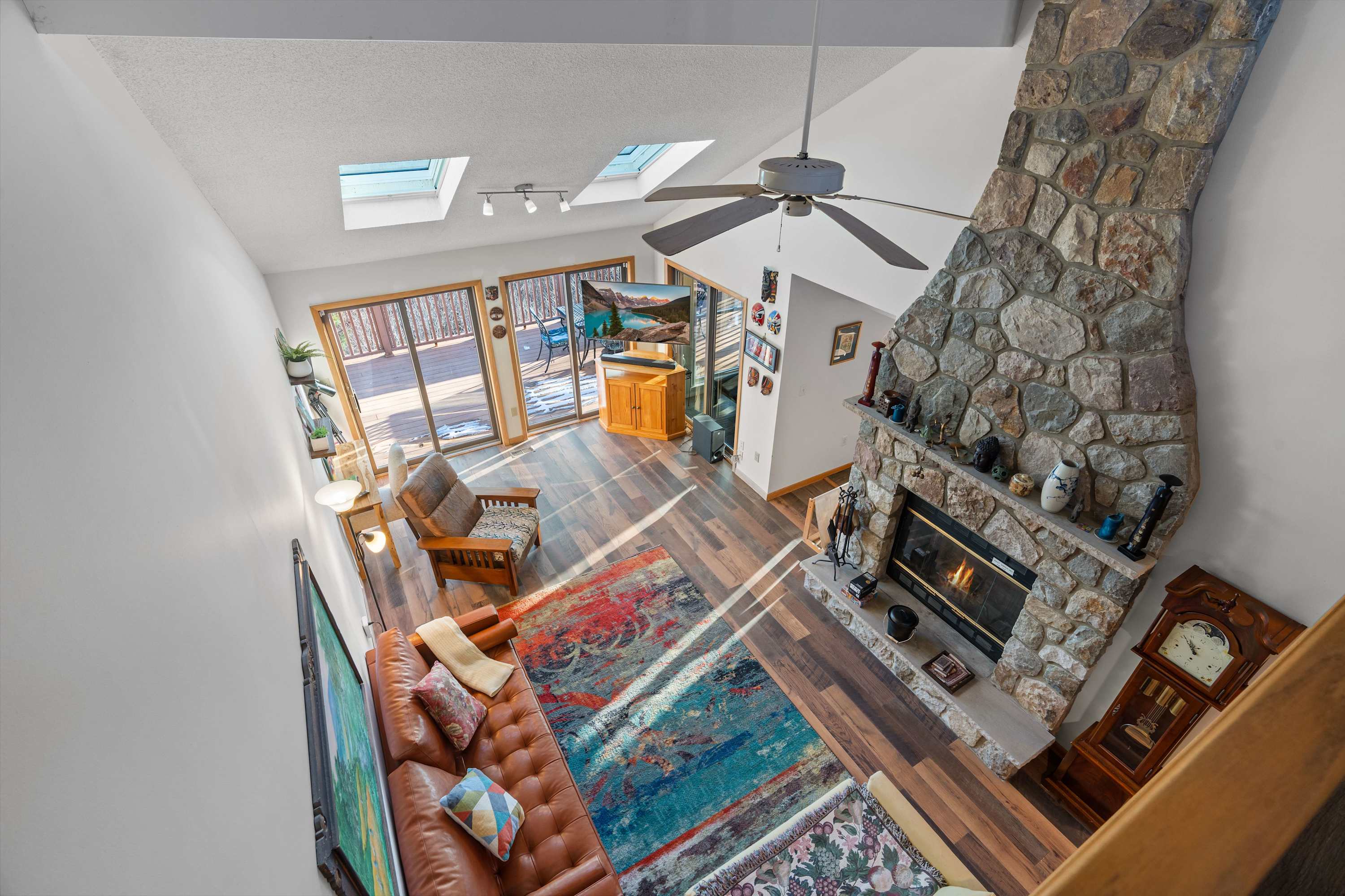 Cozy Cabin Vibes! Relax by the fire in this stunning, open-concept living space with rustic charm, natural light, and modern comforts. Your mountain retreat awaits! 