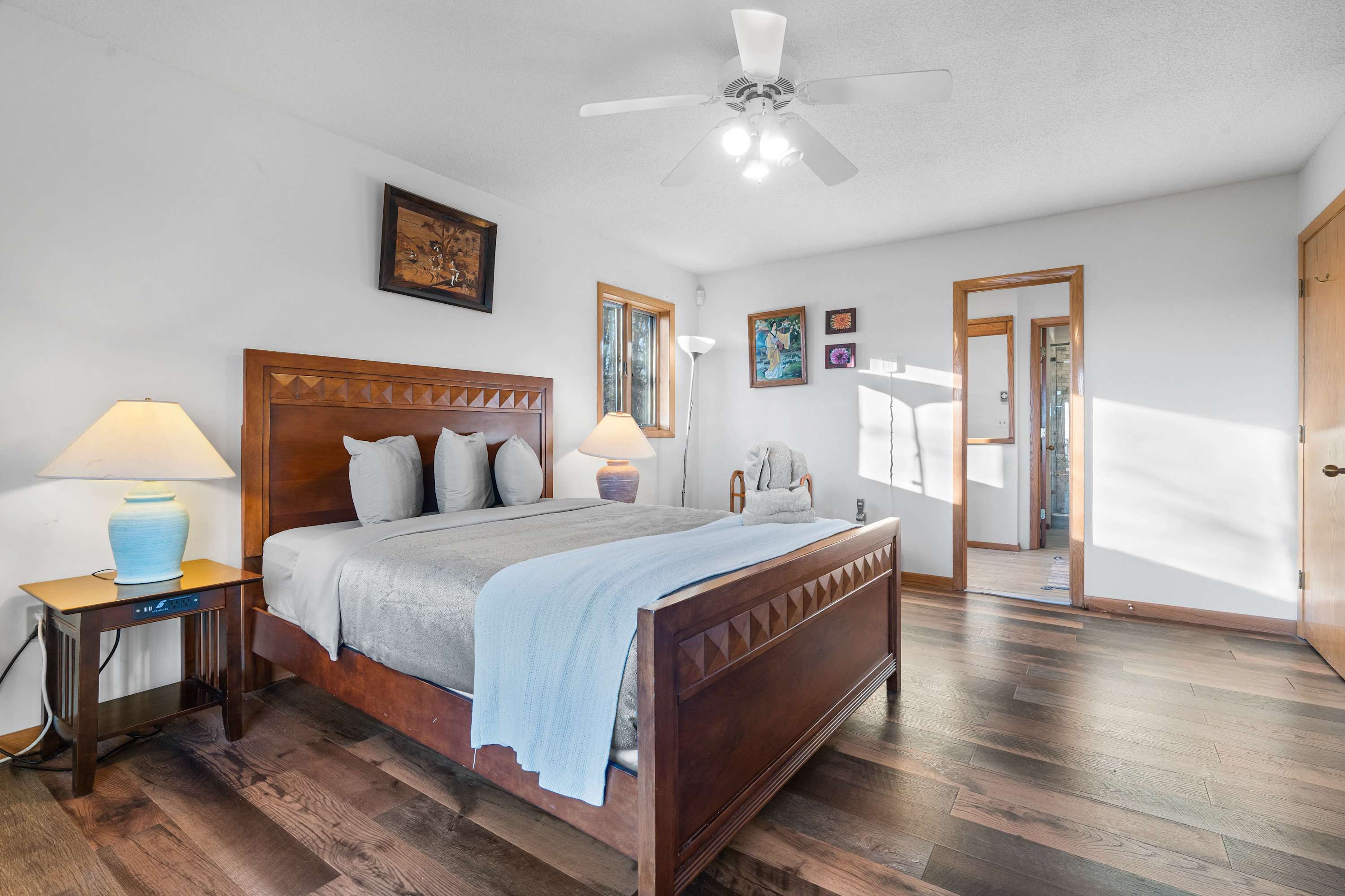 Drift into relaxation in this spacious and cozy bedroom. With plush bedding, warm lighting, and a peaceful ambiance, it's the perfect retreat after a day of adventure.
