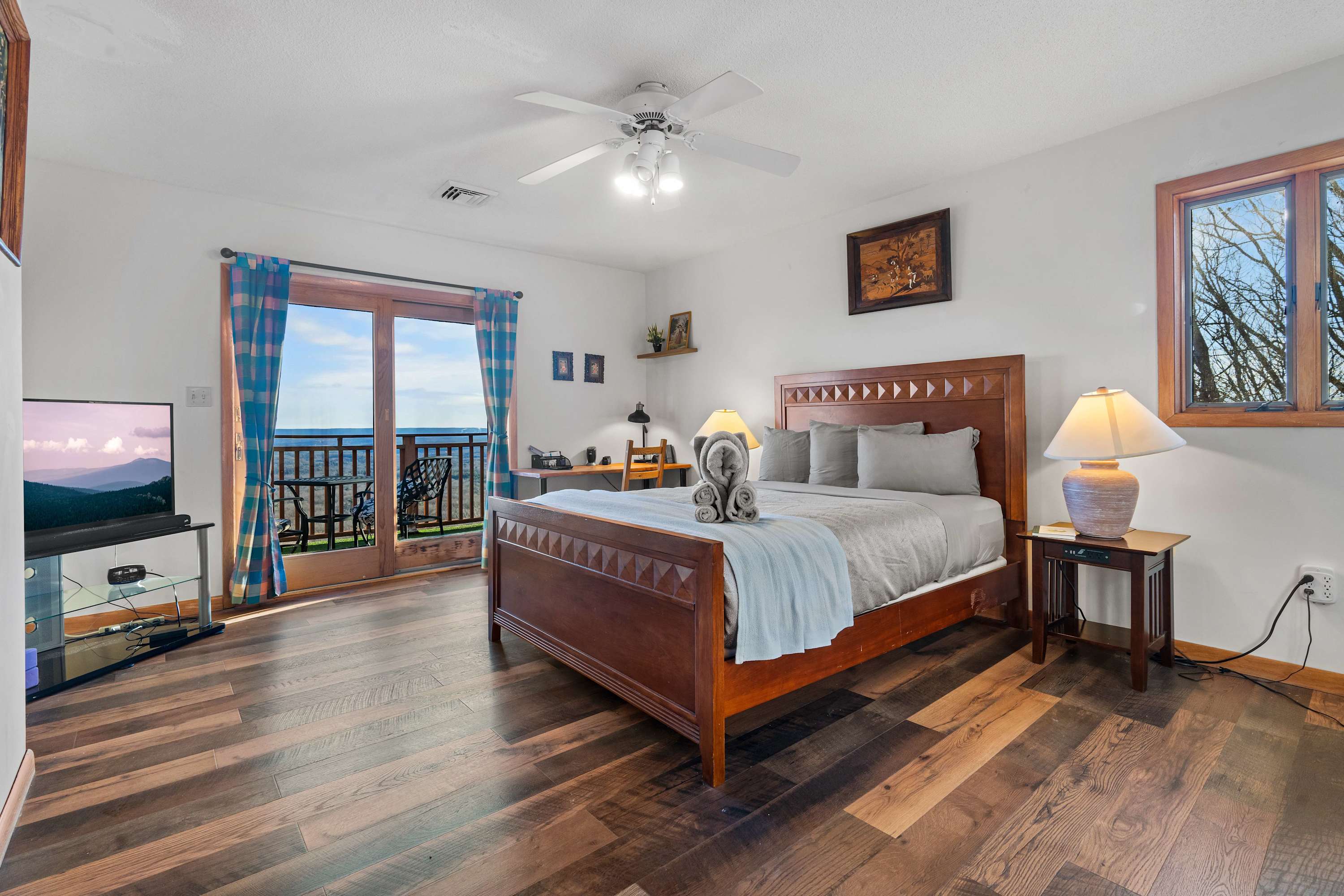Wake up to breathtaking views right from your bed! This serene bedroom offers ultimate comfort and a private balcony to soak in the beauty of nature. Your perfect getaway awaits!