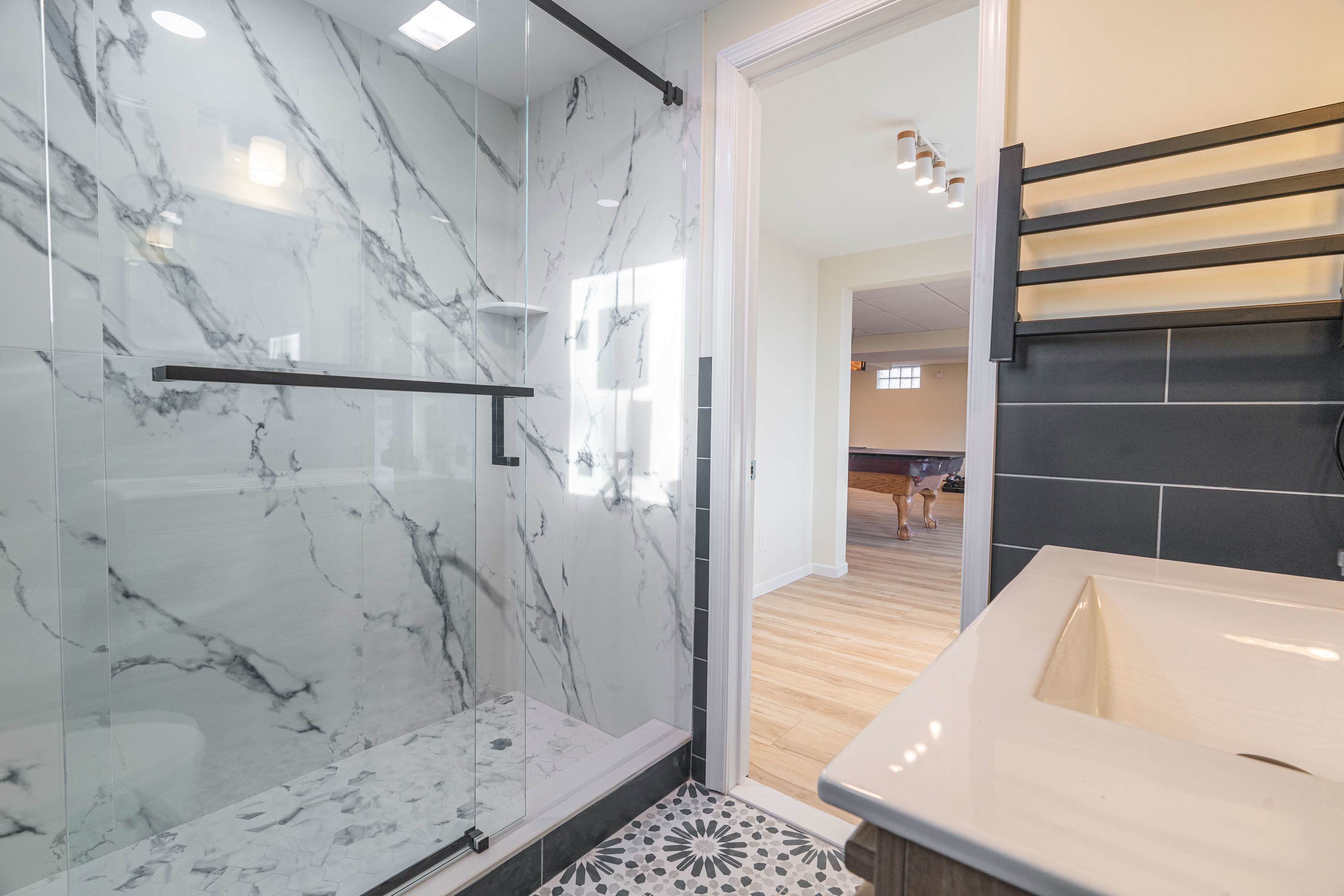 Indulge in a sleek, marble-inspired shower retreat.
