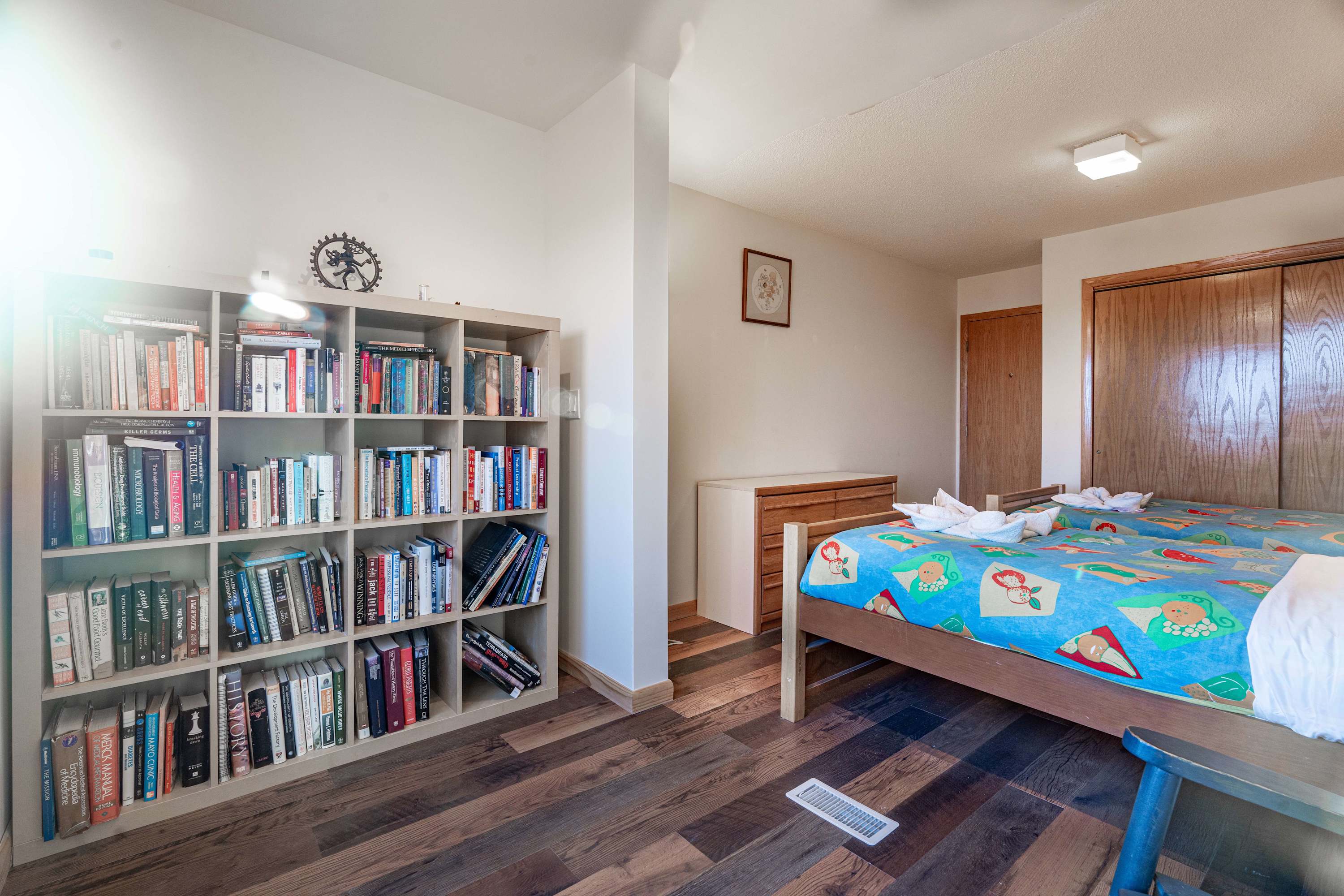 Bright floors, cozy beds, and a mini library, everything you need for a restful stay.