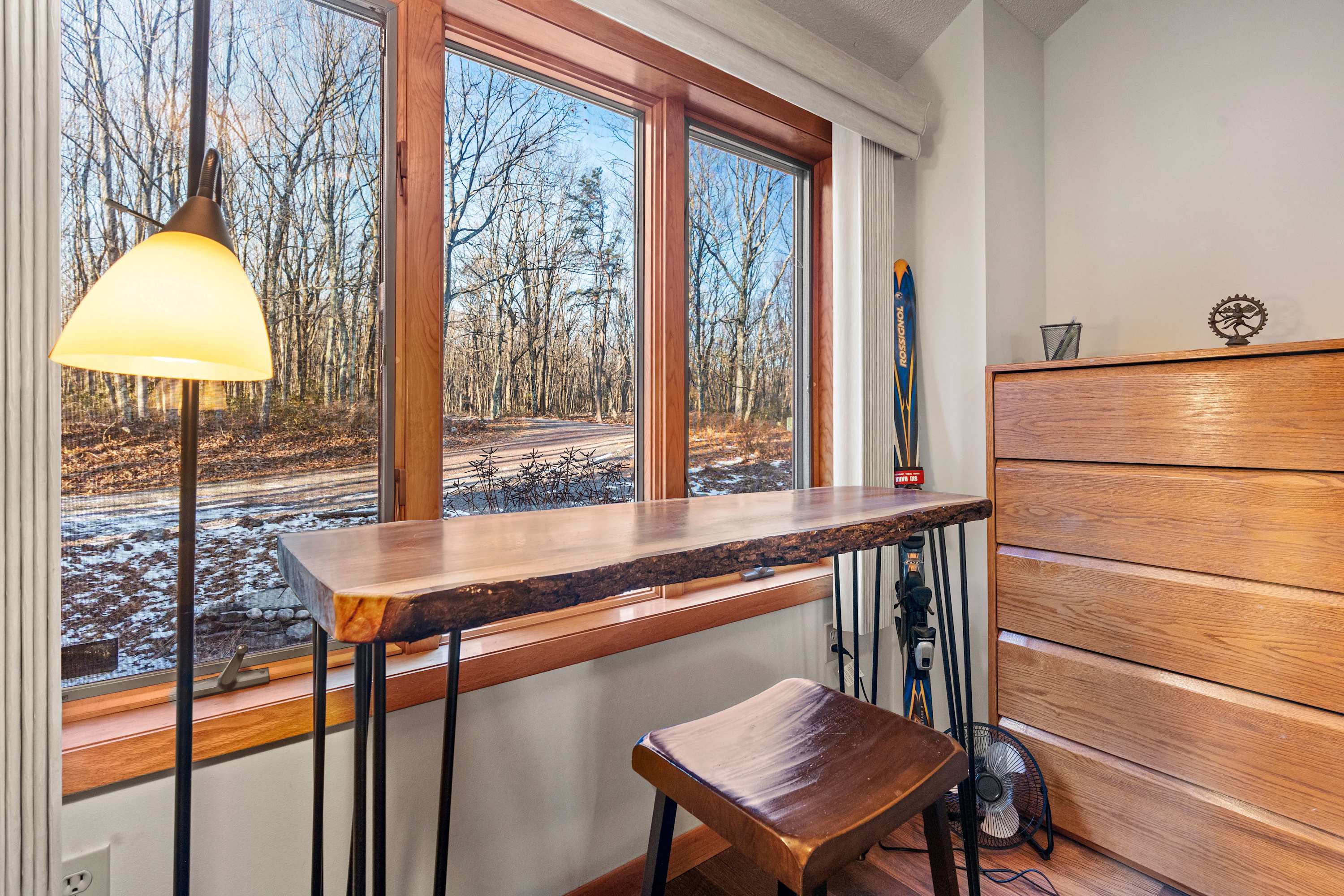 Enjoy nature’s backdrop from the comfort of this rustic workspace.