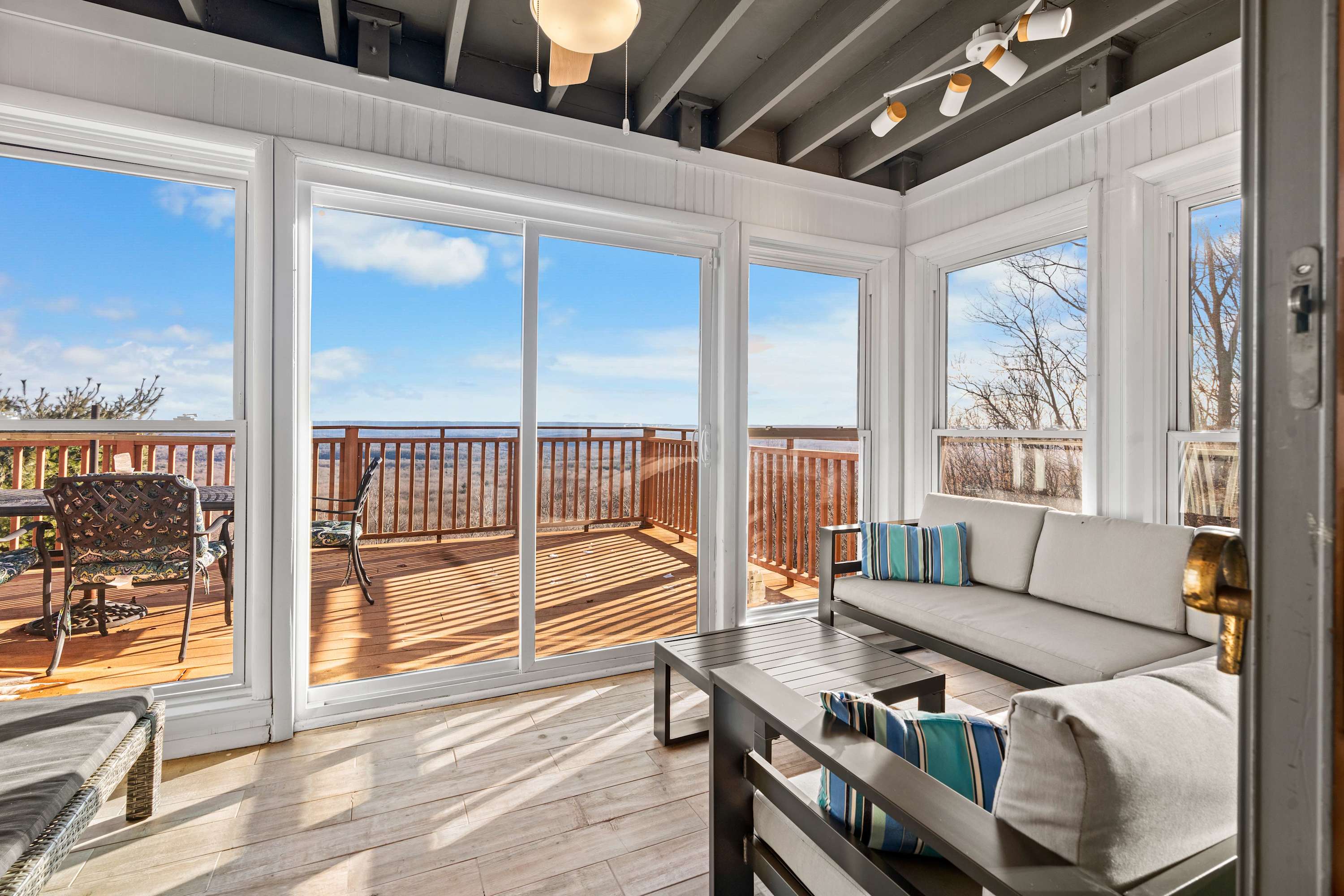 Wake up to panoramic beauty right from the comfort of this sunroom.