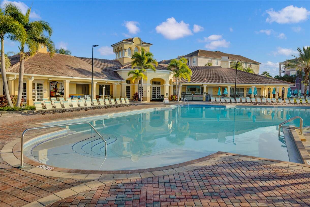 Resort Pool With Refreshing Water And Relaxing Lounge Areas