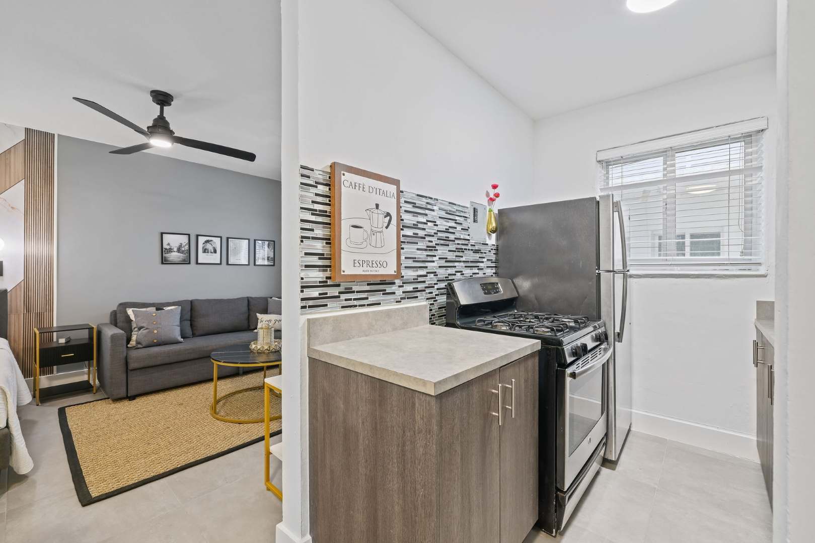 Charming kitchen with modern touches and cozy living area, perfect for a relaxing stay.